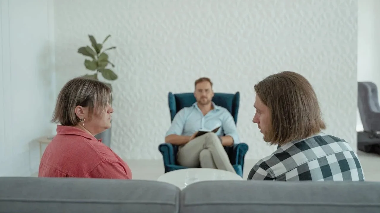Couple attending a Gottman Method couples therapy session in Alberta with therapist guiding communication exercise.