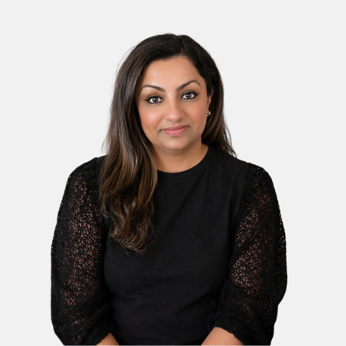 Image of mental health therapist named Amy who is wearing a black blouse and smiling.