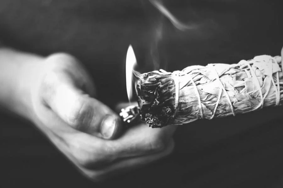 Lighting a sage bundle at Thundermaker Wellness Center in Prescott, Arizona