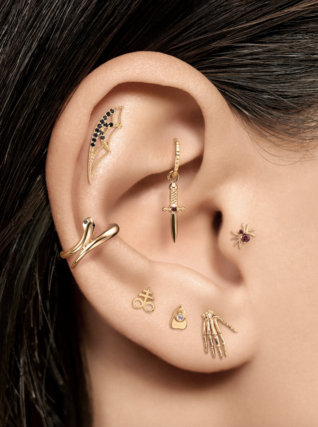 enigma-ear-curation-gold-dagger-leaf-stack.png
