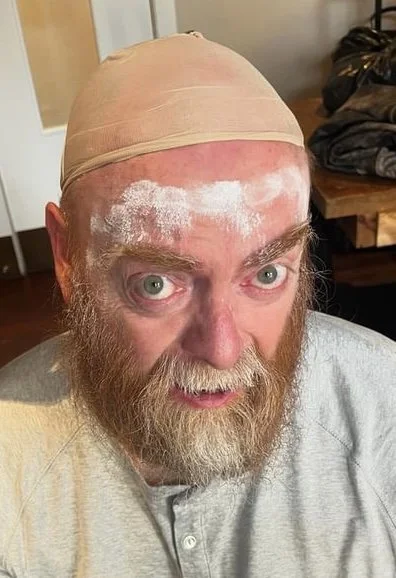 Ah, right. Wig fitting on a head that has most of the skin peeling off it already.
