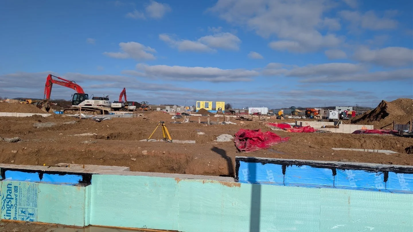 Exciting things are happening in Uptown! The foundation has been poured for the rehab hospital at East Cheryl Parkway and Greenmarket Place, and the first wall is going up! Meanwhile, work is moving quickly on the Lido Apartments at East Cheryl Parkw