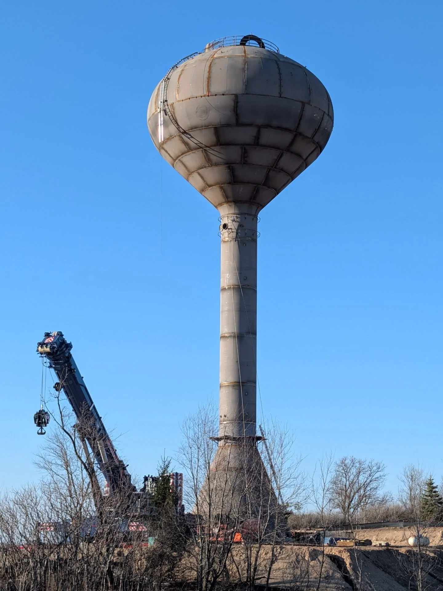 It's a bird! It's a plane! It's... Water Tower D! The day we've been waiting for has arrived!

It may look "done," but there's a lot more work to do! You may see some welding taking place from the inside (that's the flash you can see in a c