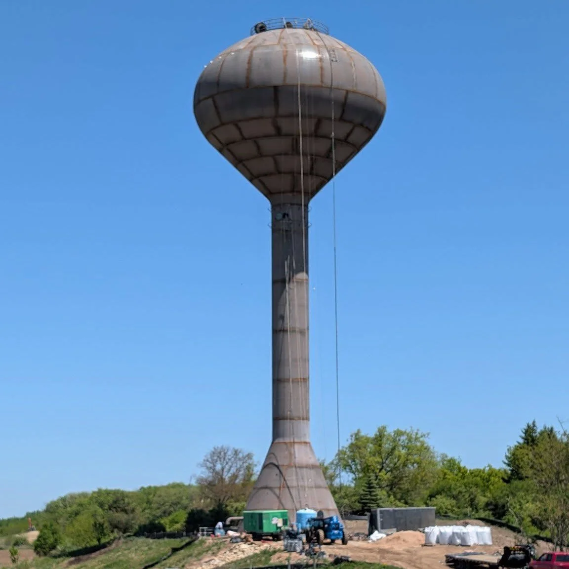 Goodbye, "Franken-tower"! Water Tower D is getting a fresh coat of paint, but you may not see much of the work happening -- there will be a cover to keep the paint debris from making too much of a mess.

#FitchburgWI