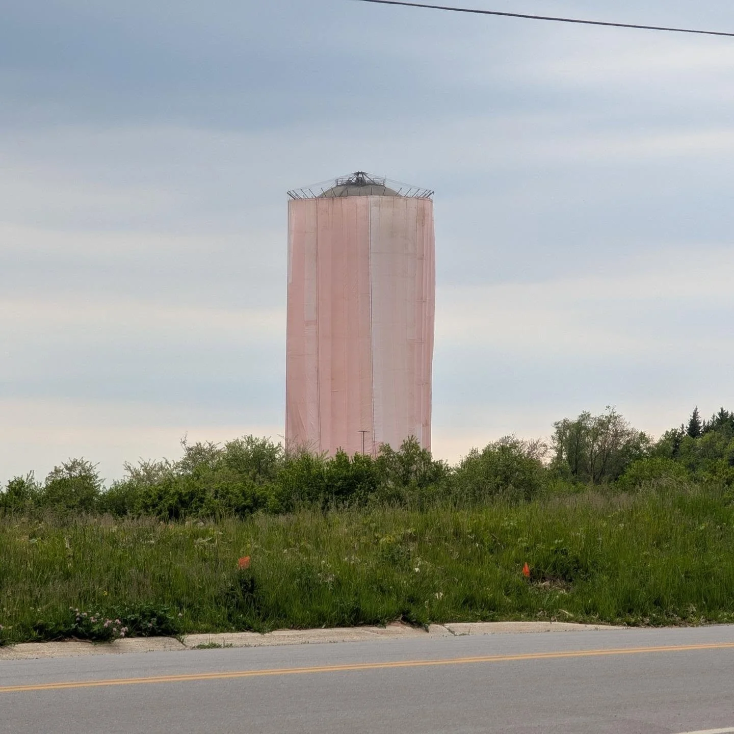The cover is up, which means Water Tower D painting can begin in earnest! This cover will keep paint from making a mess during the painting.

#FitchburgWI