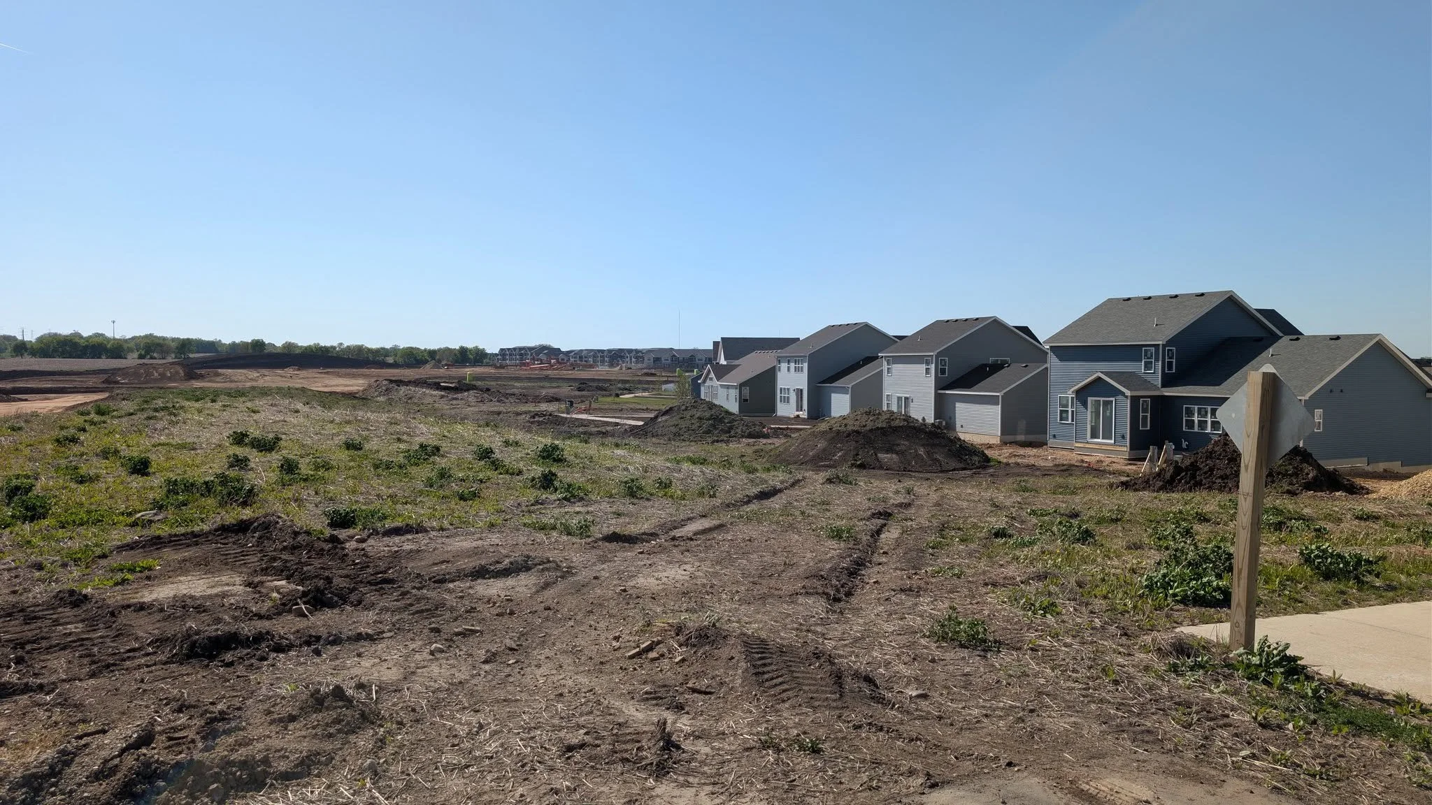 Construction site with homes in the background