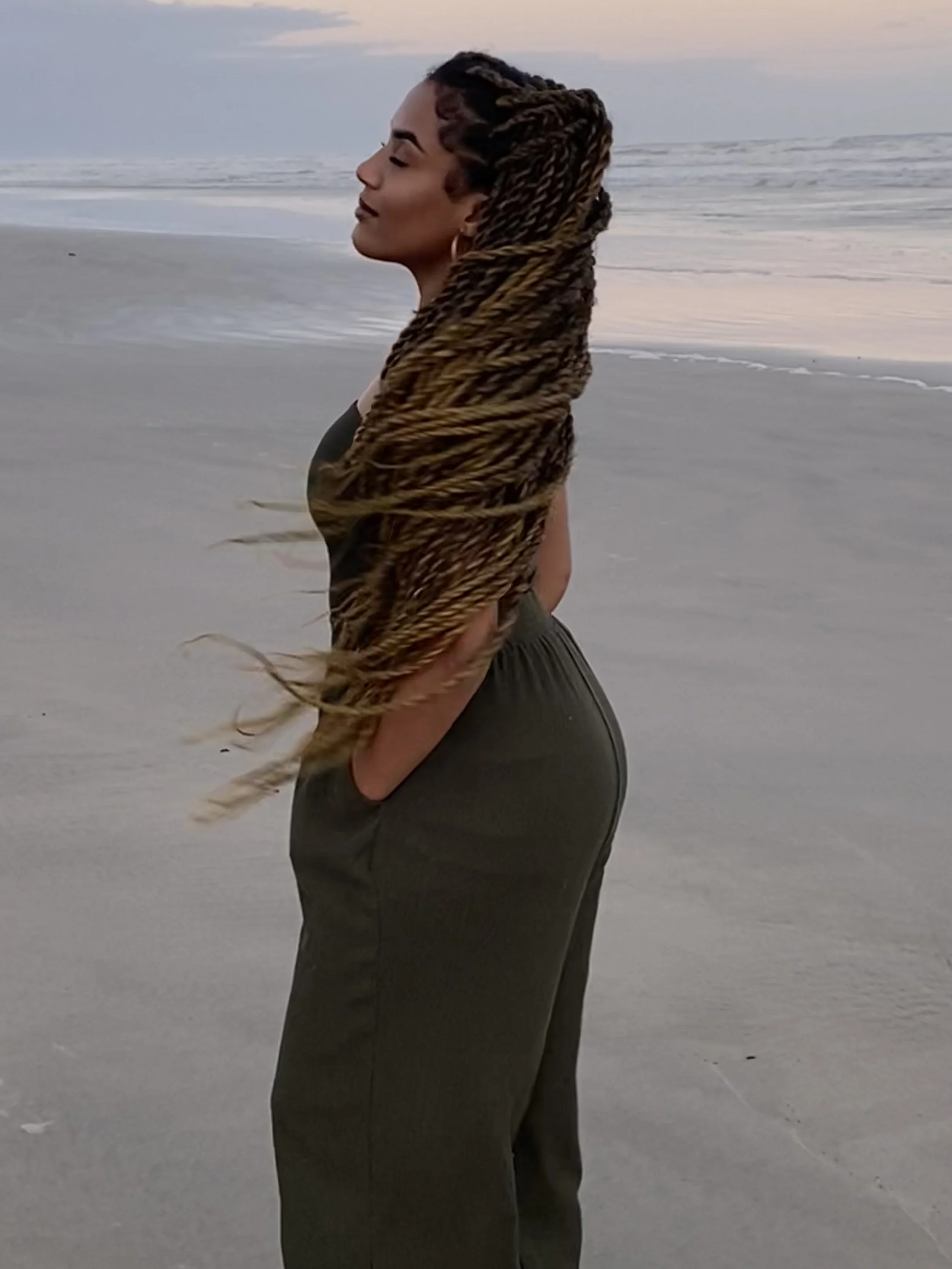 woman looking out to sea confident in her abilities to set boundaries