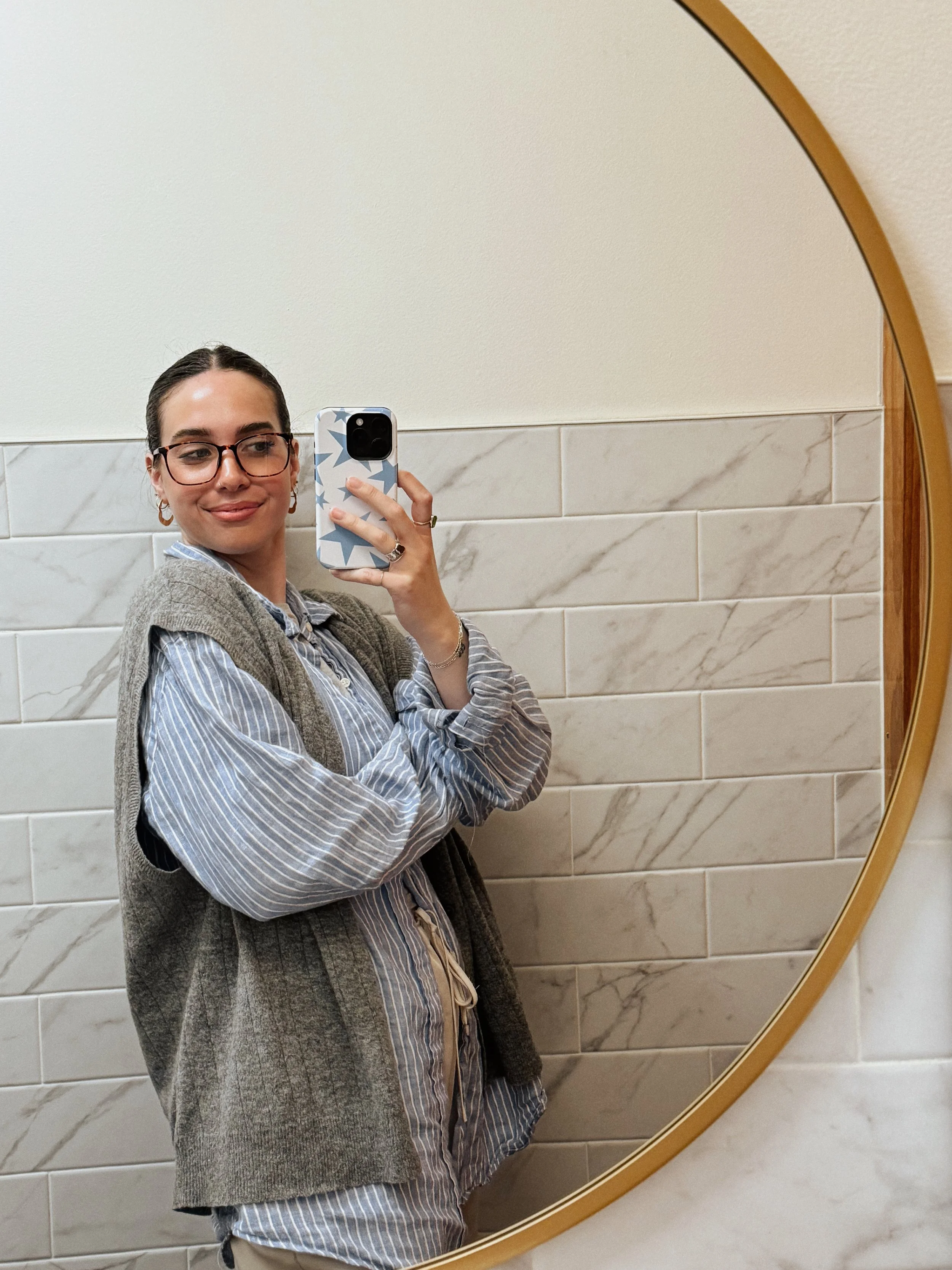 woman taking a selfie in the mirror representing positive self talk