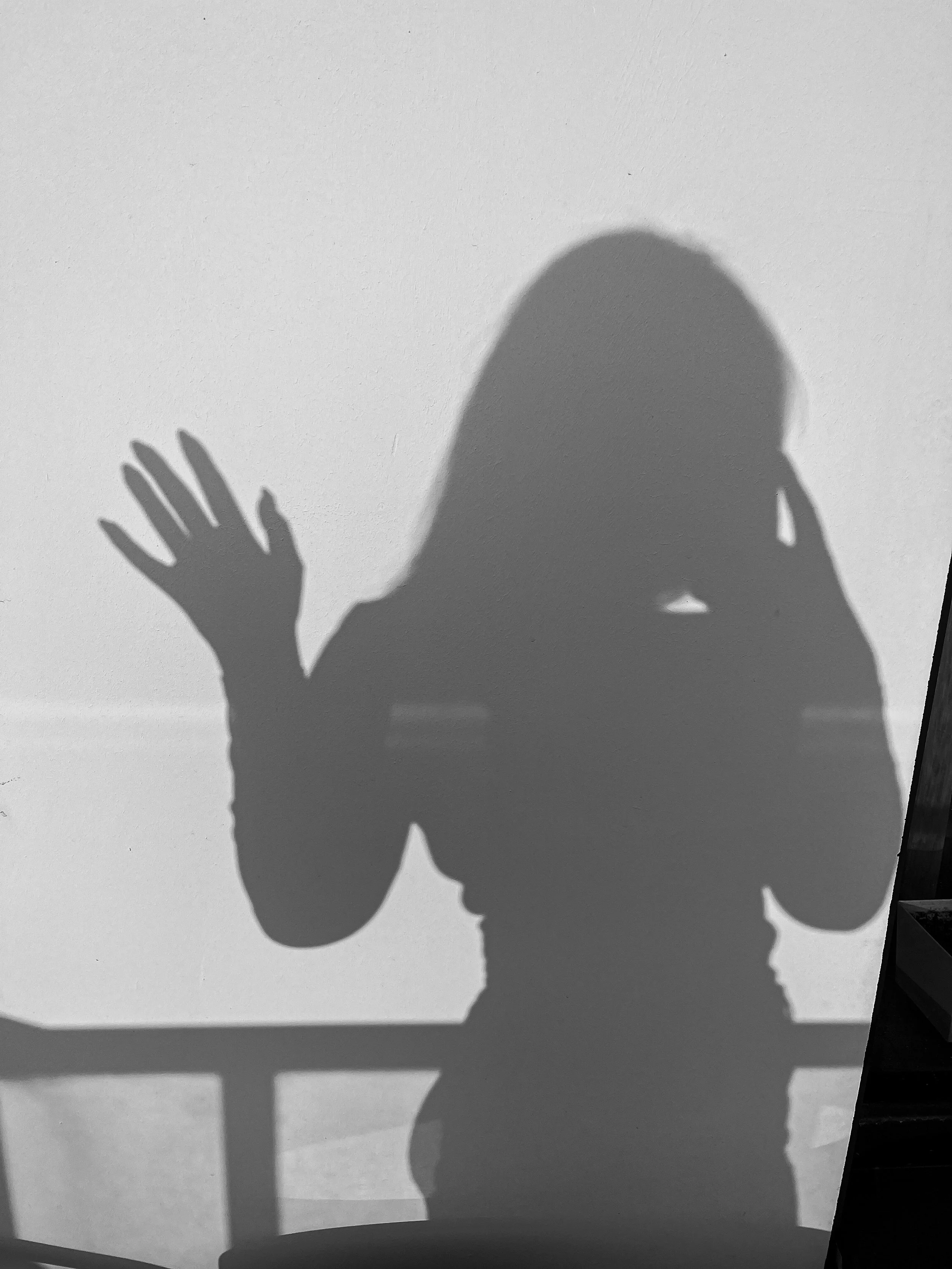 shadow silhouette of woman representing an inflated sense of imposter syndrome