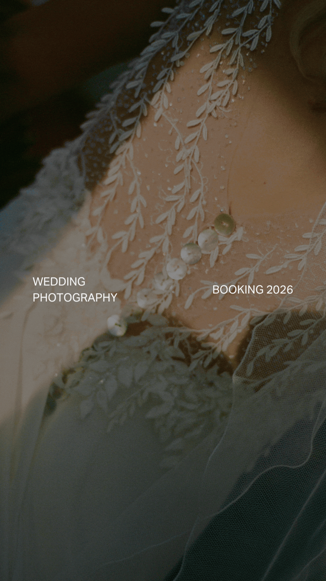 Close-up of a bride's shoulder with lace and pearl details on her wedding dress.