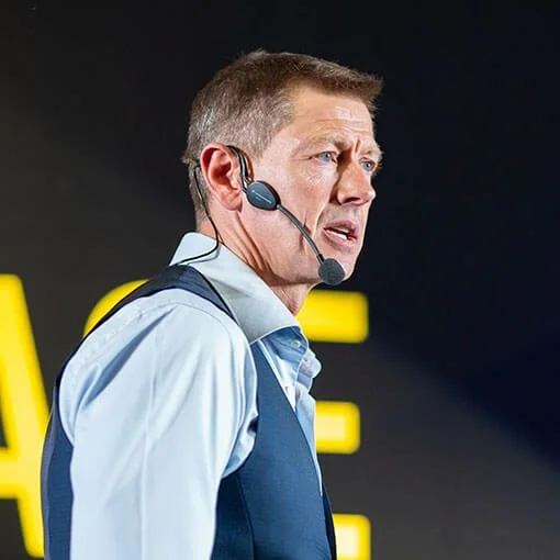 Man speaking with a headset microphone