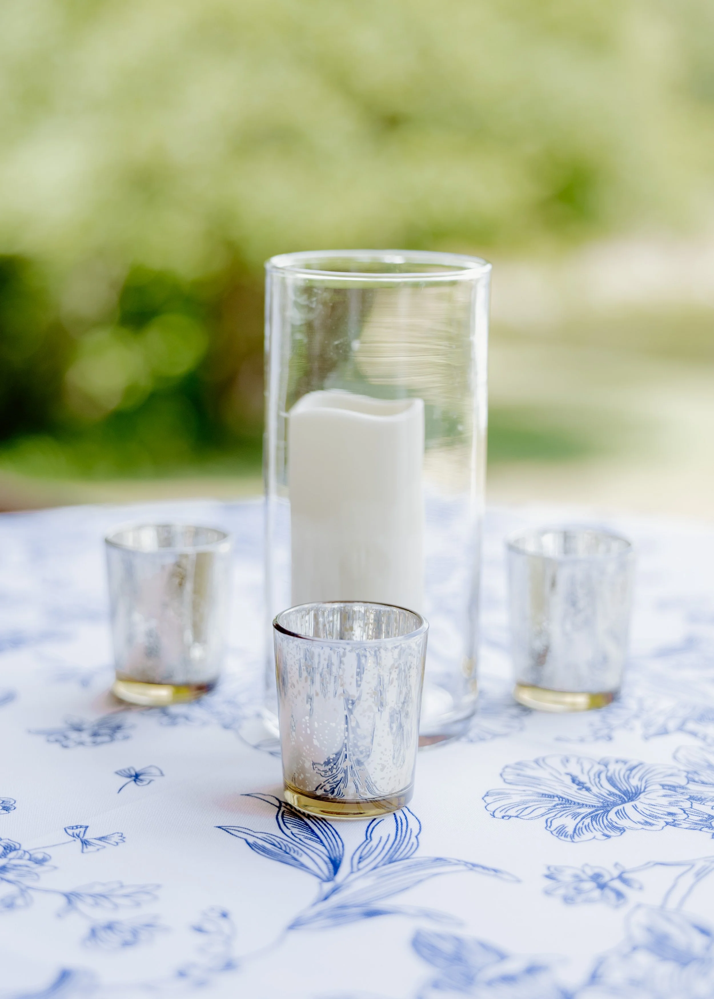 Clear Hurricane Vases - $1.50 each
Flameless Ivory Pillar Candles (various sizes) - $1 each
Champagne Gold Tea Light Votives - $0.50 each (without candle)