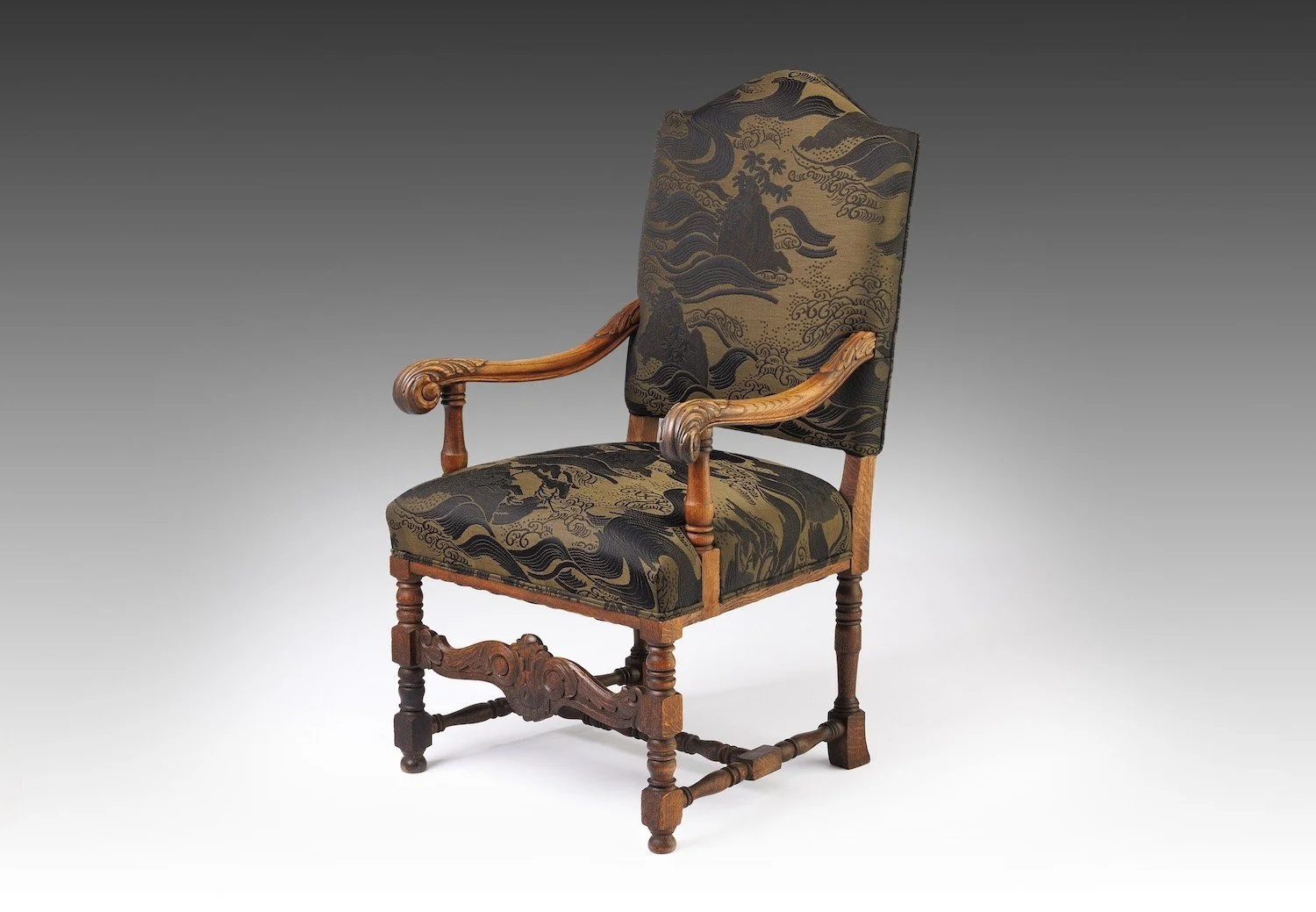 Late nineteenth-century carved oak armchair, The Solstice Crest, shown with restored upholstery and original structure intact.