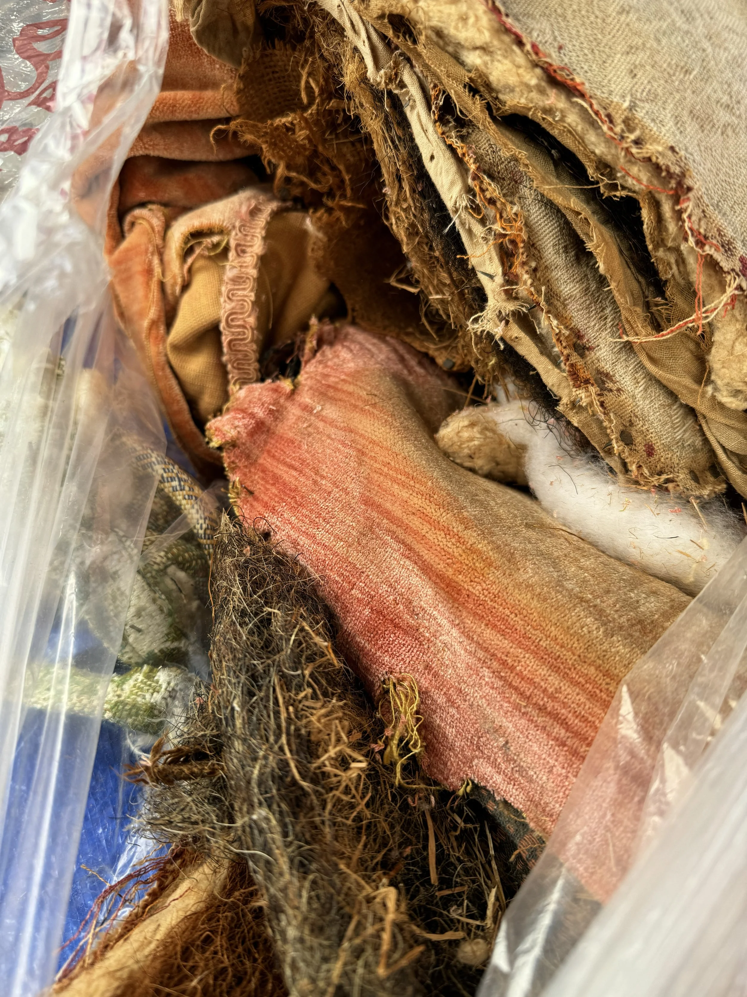 19th century Victorian slipper chair upholstery layers showing horsehair, hessian, cotton wadding and worn textile removed during restoration