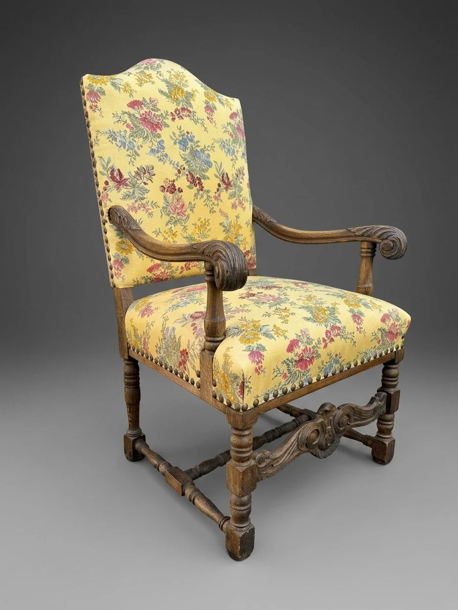 The Solstice Crest antique armchair before reupholstery, the carved oak frame in its cleaned finish