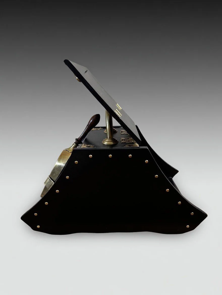 antique coal scuttle side profile showing curved wood body and brass brackets with the lid open