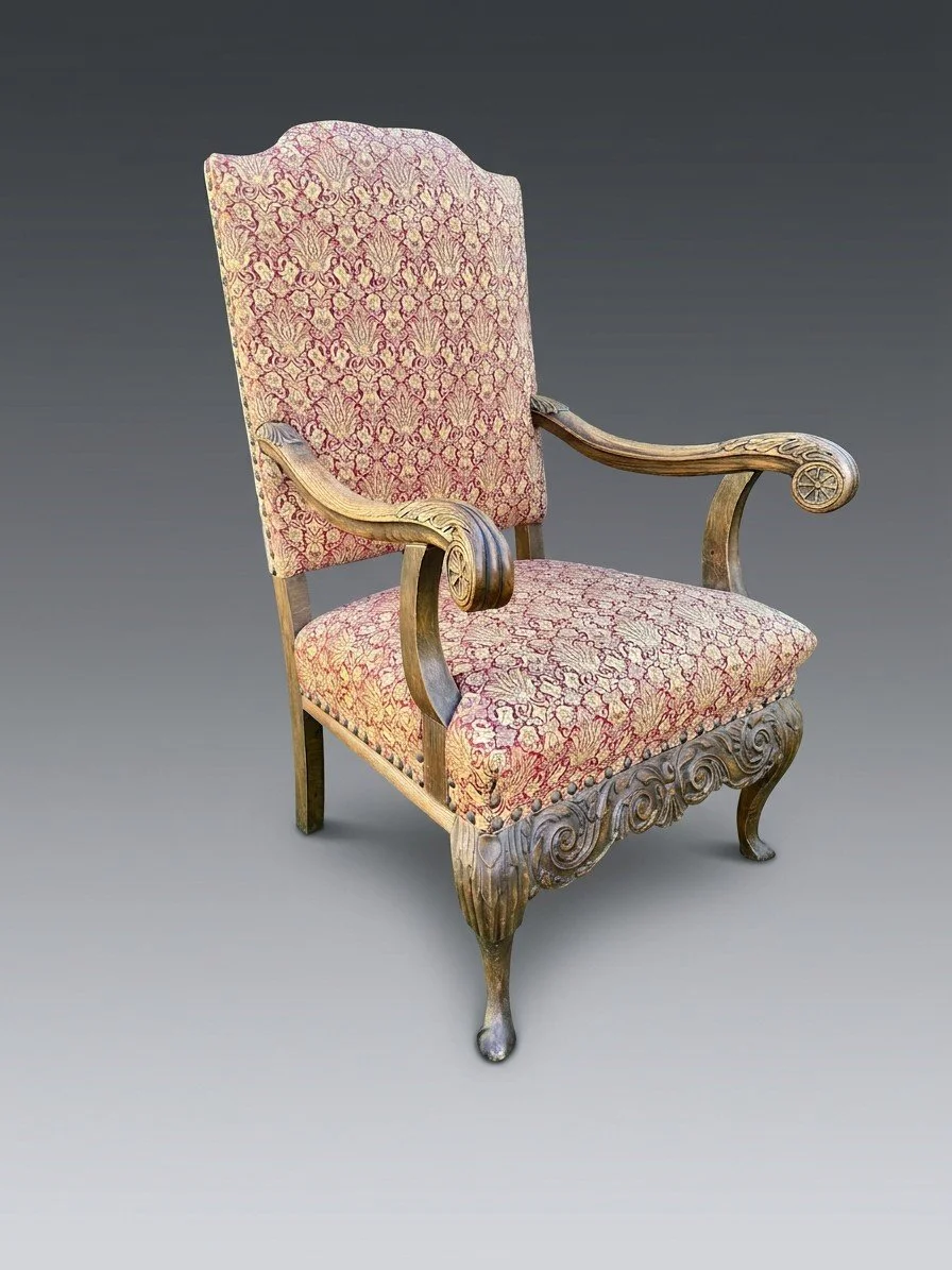 The Horizon Crest armchair before restoration, in its earlier red and gold damask covering, the carved show-wood frame unrefinished