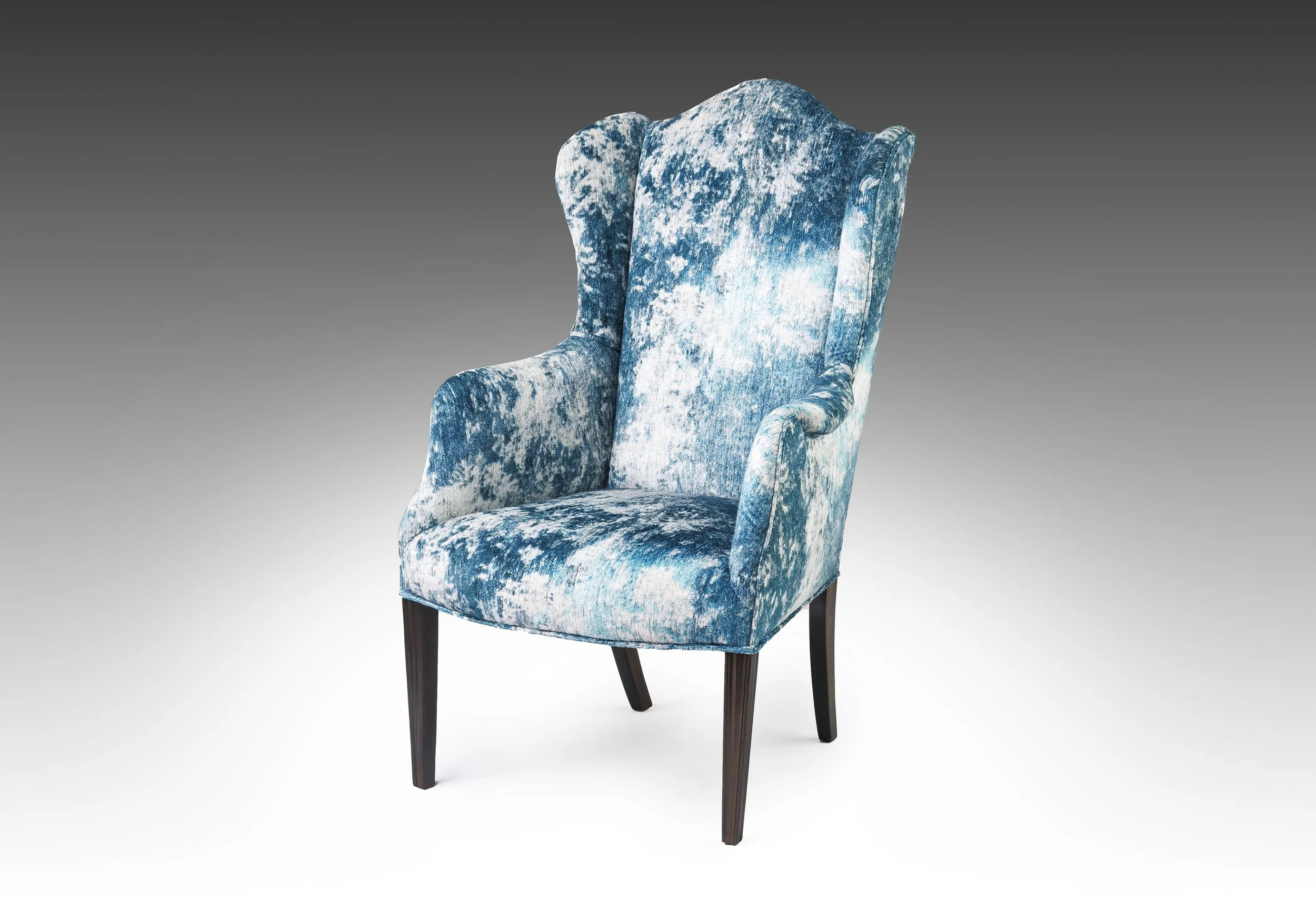 A George III style wingback reupholstered in Black Edition Kensu printed velvet