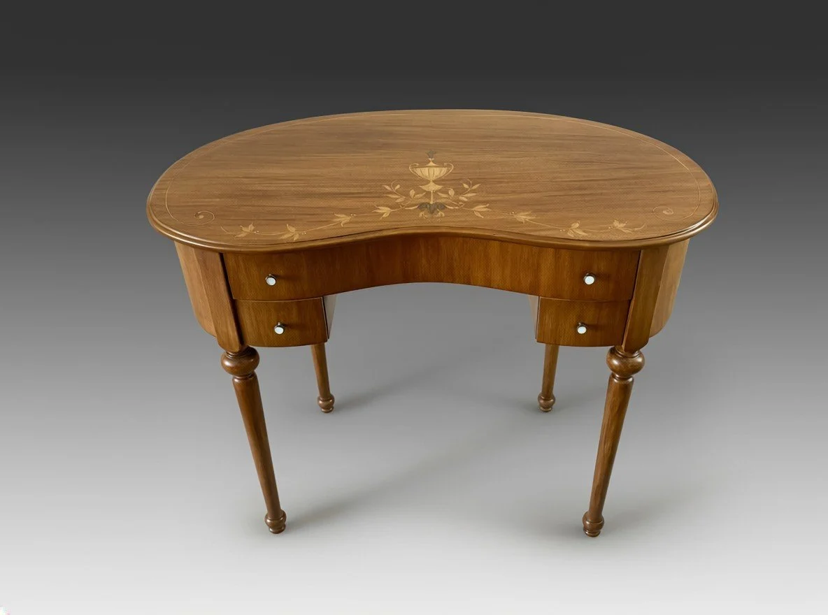 Detail of the inlaid top, showing the urn-and-foliate marquetry and a pedestal drawer with a pale disc knob