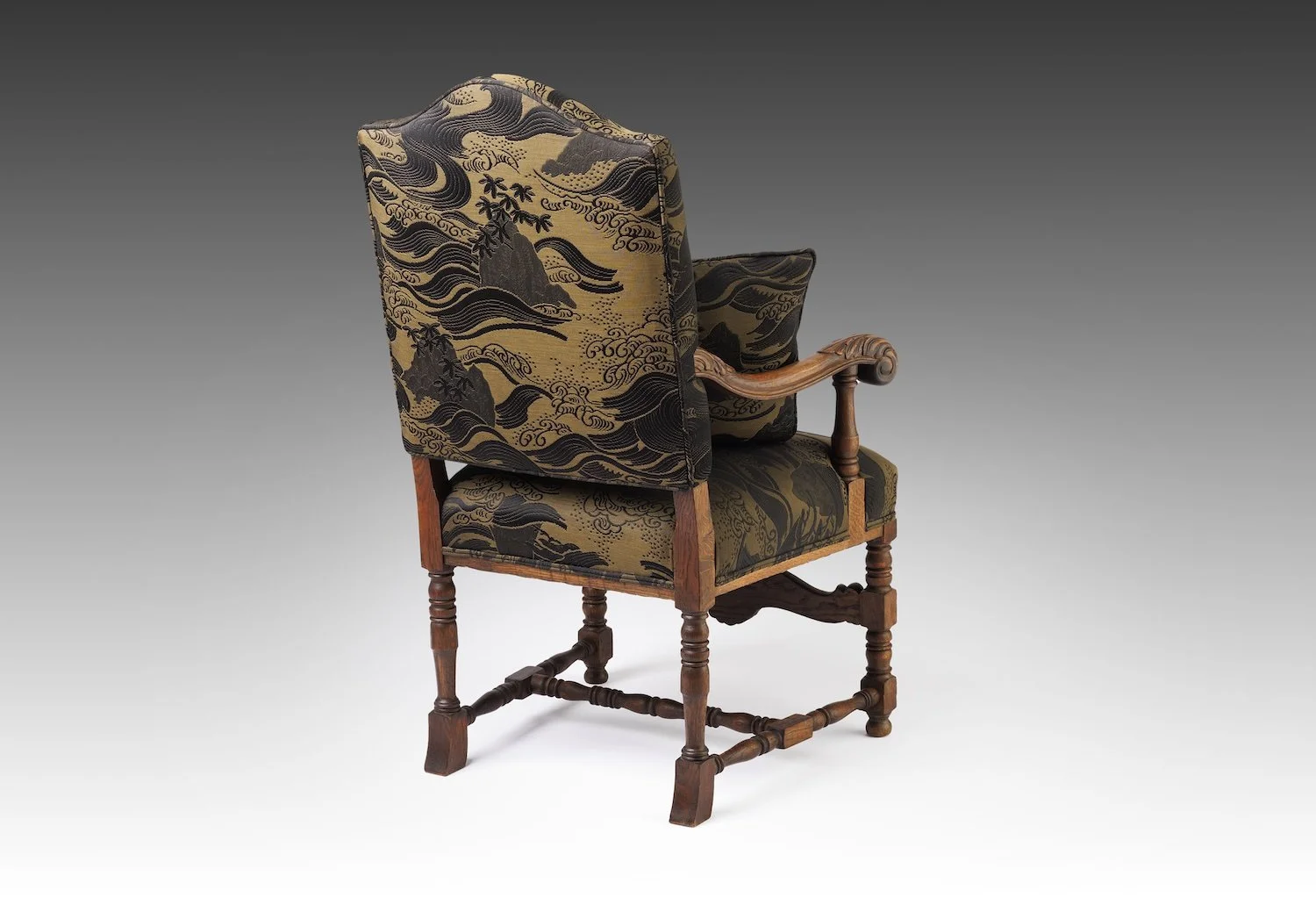The Solstice Crest is a couture Baroque-style oak armchair in gold matelassé—a luxury heirloom with sculptural form and historical elegance.