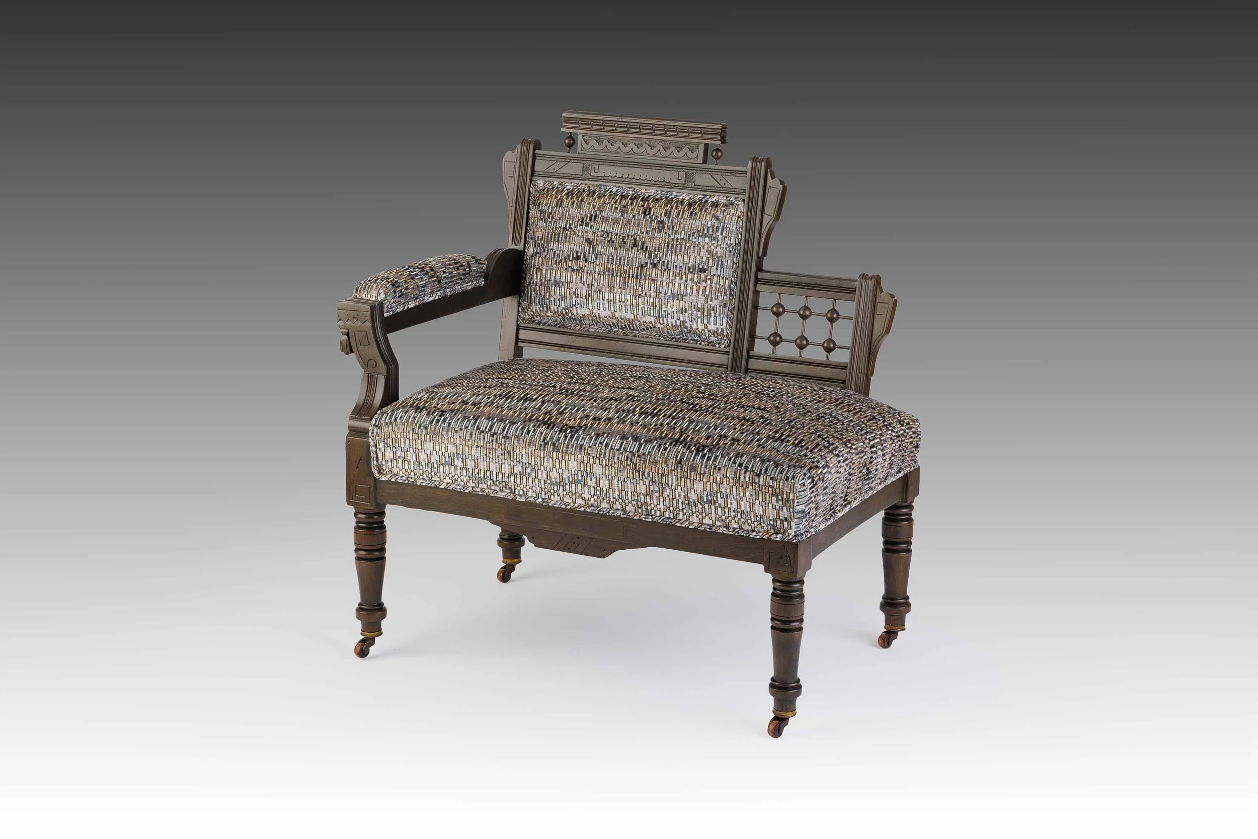 Asymmetrical antique settee reupholstered in Tiano Gunmetal velvet, part of the Vesperline collection by Acanthus Home.