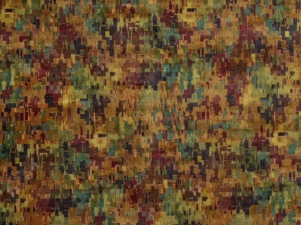 Close-up of the multicolored abstract pile-woven upholstery in golds, greens, reds, and blues