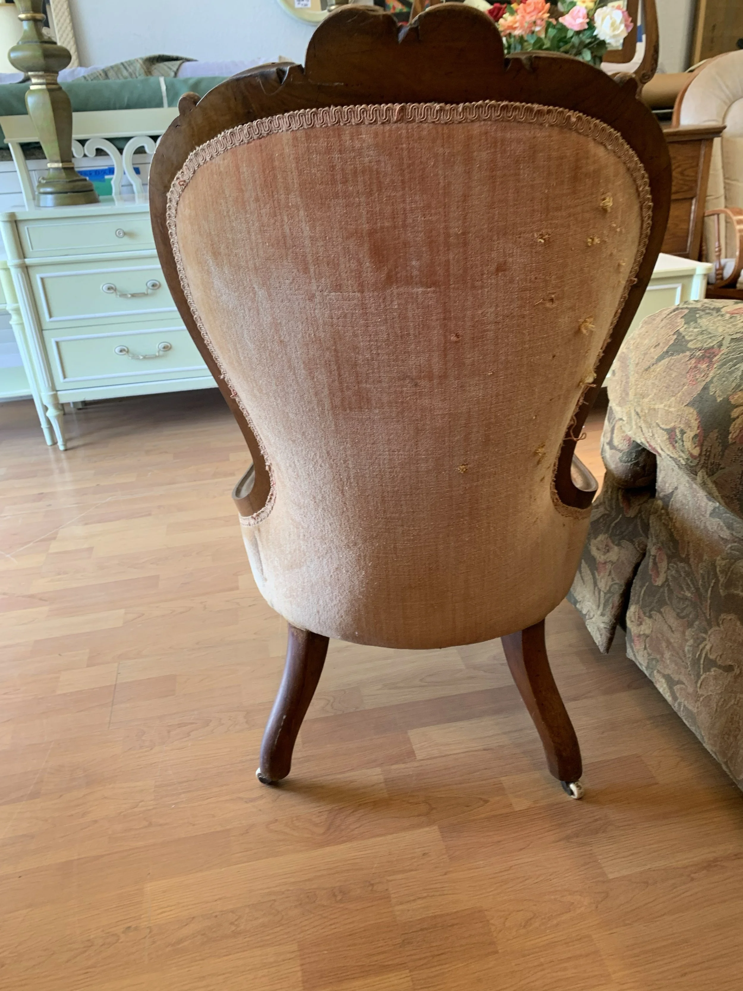 Victorian slipper chair back view before restoration with worn pink velvet upholstery, loss at edges and visible surface deterioration