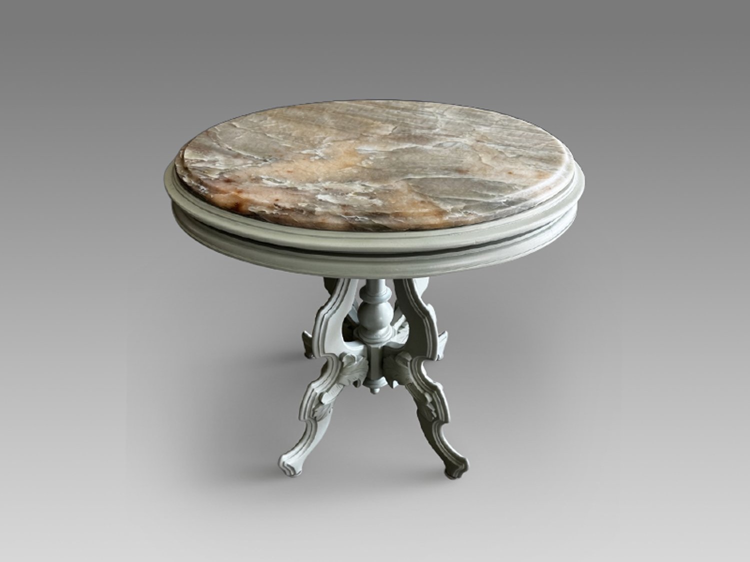Sage-green painted side table with an amber-and-grey Alexandrita quartzite top, three-quarter view