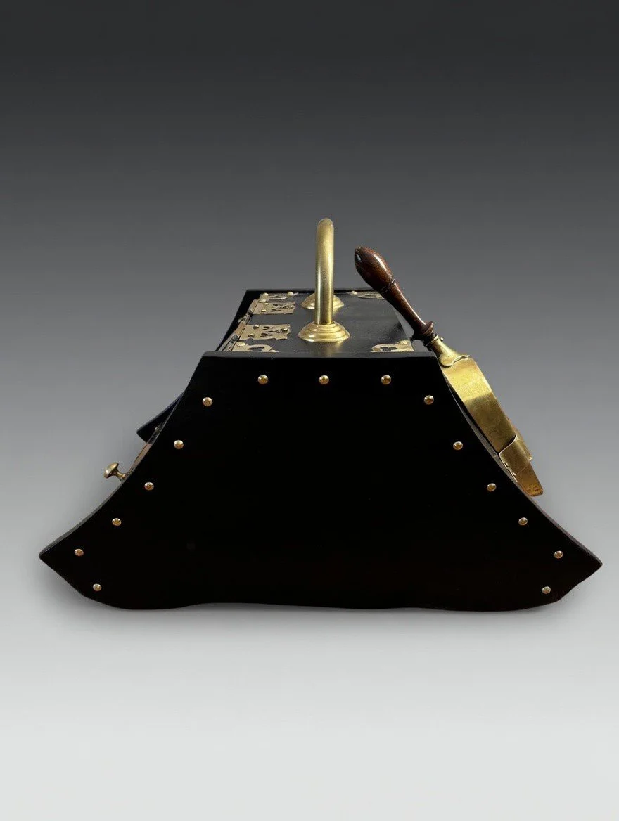 antique coal scuttle side profile showing curved wood body and brass brackets