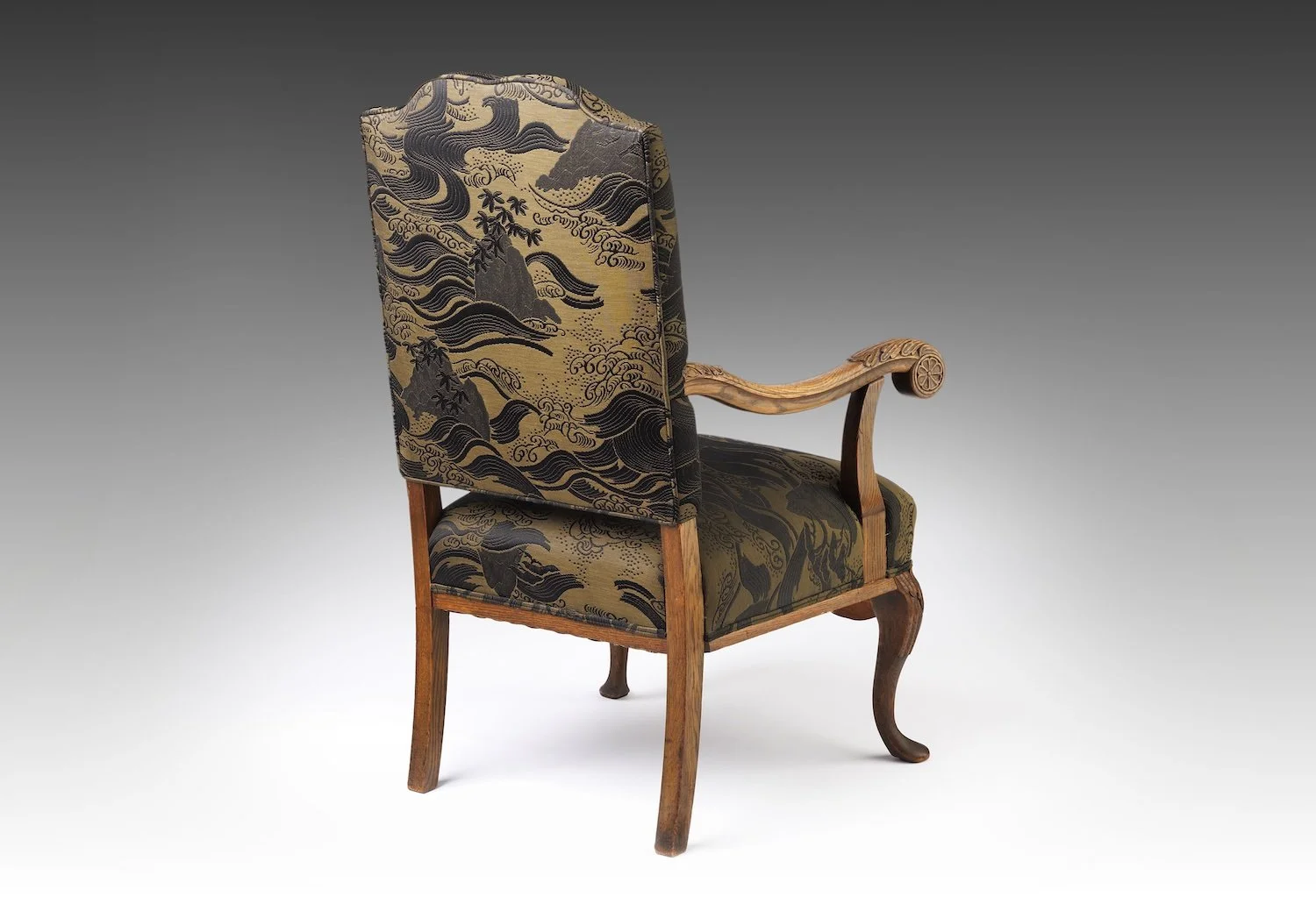 The restored Horizon Crest from the rear, showing the reupholstered bronze back panel and a carved arm terminal