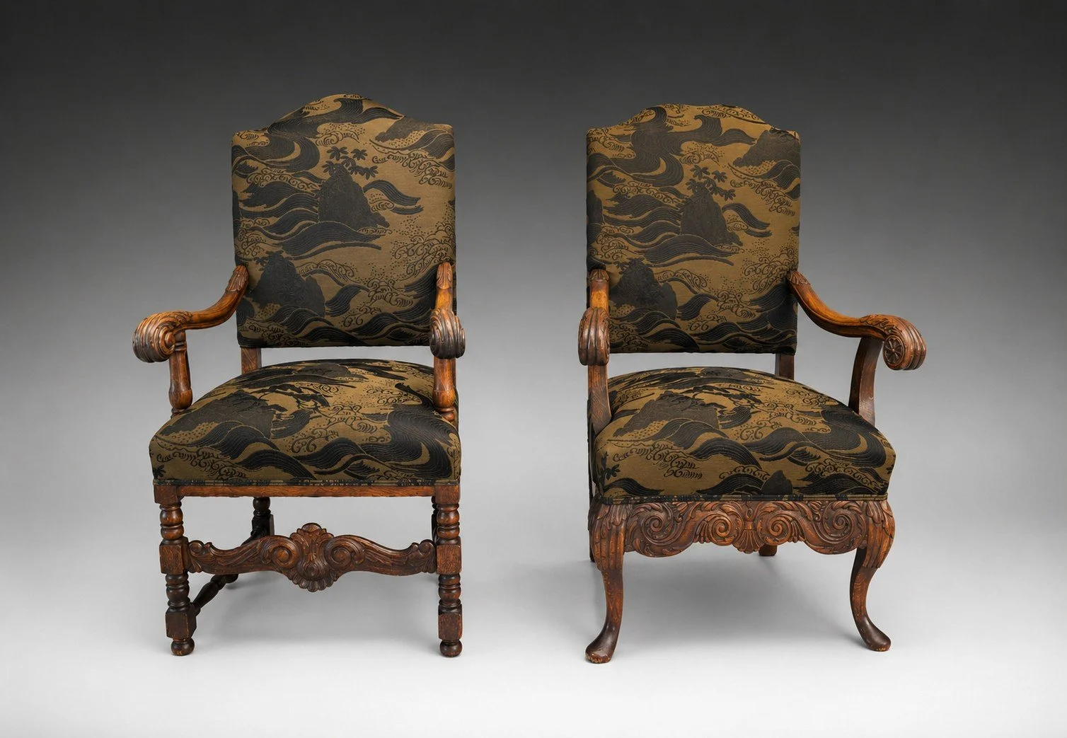 Restored antique oak armchairs, The Solstice Crest and The Horizon Crest, shown together with carved frames and coordinated upholstery on a gray gradient studio background.