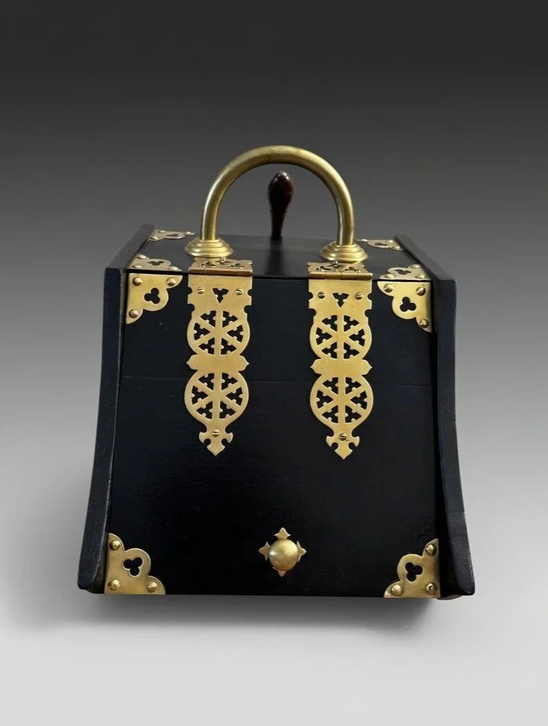 antique coal scuttle in black with brass hardware, front view
