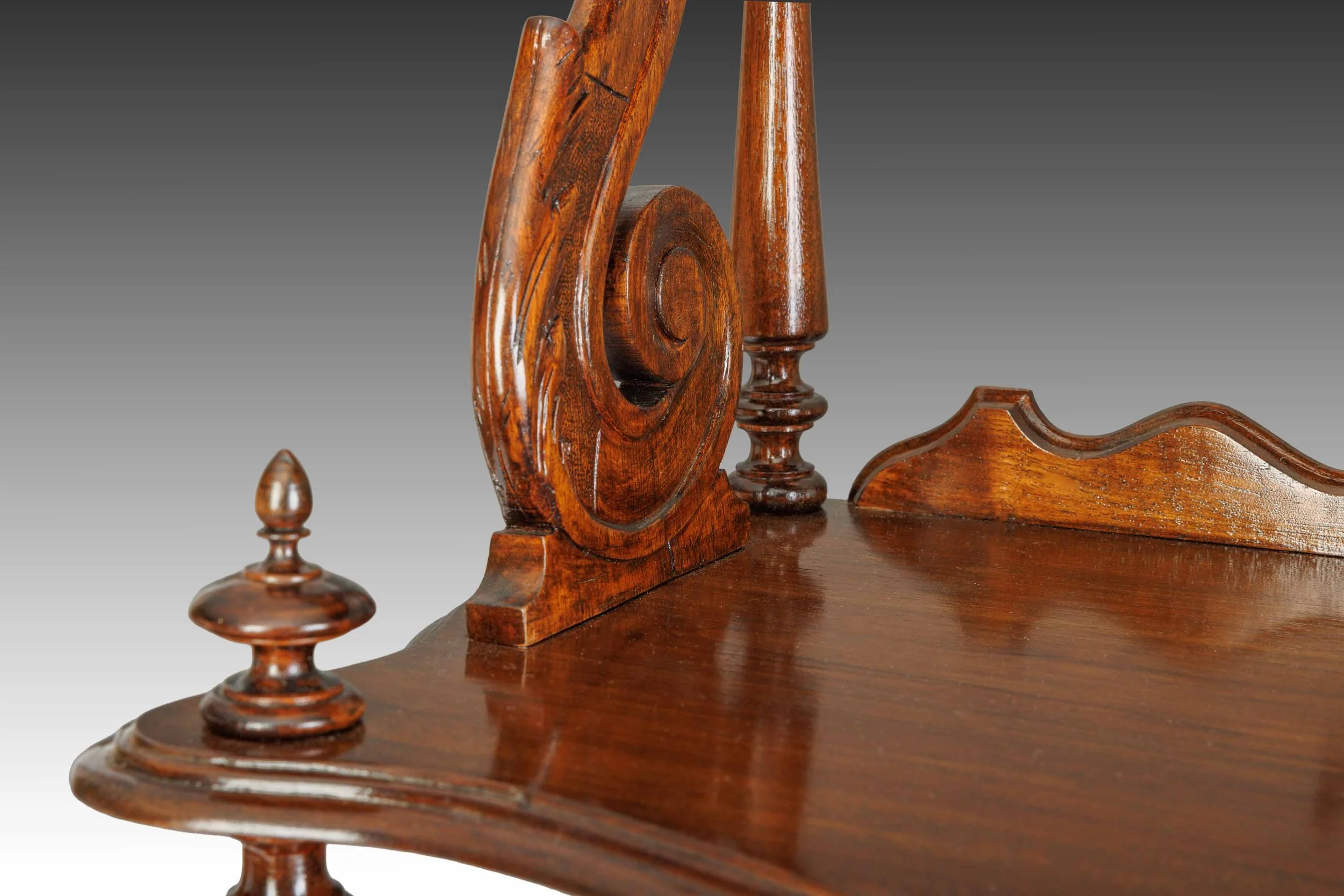 Carved scroll support detail on The Bracknell Whatnot, highlighting its Victorian craftsmanship and polished walnut finish.