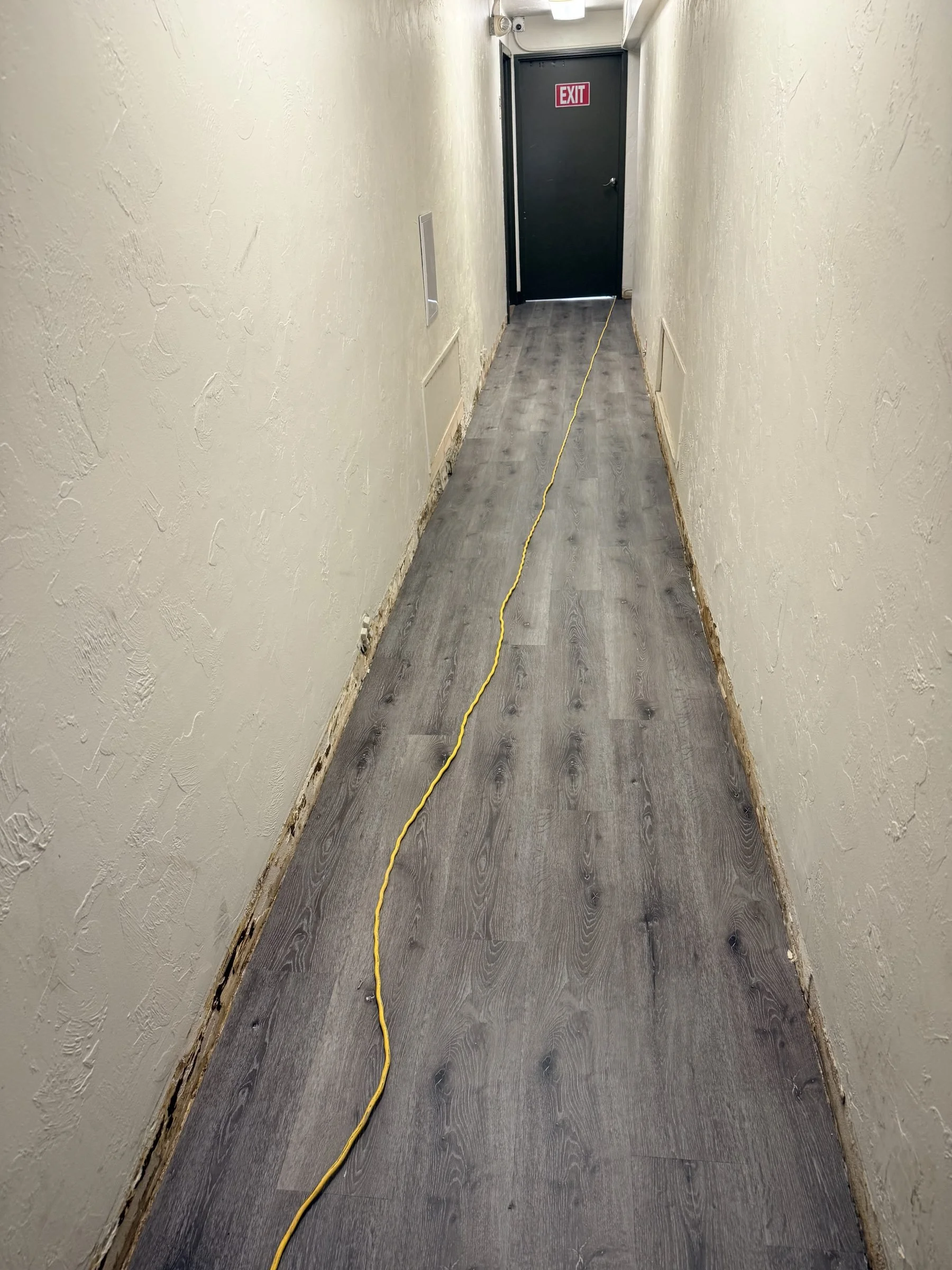 LVP flooring in apartment building corridor