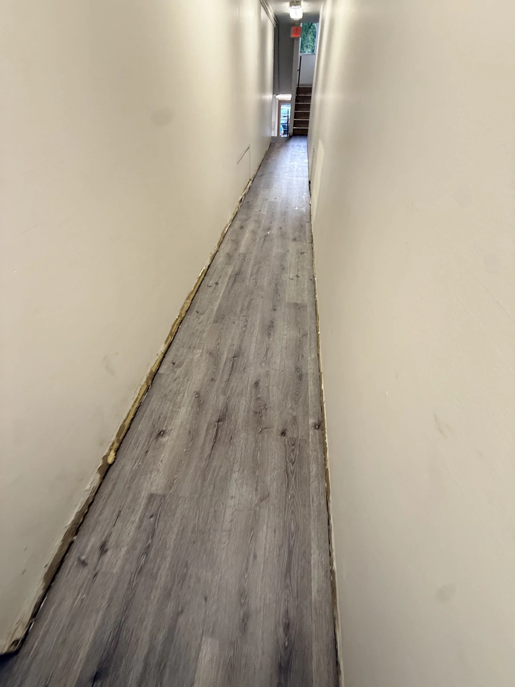 LVP flooring in narrow apartment hallway