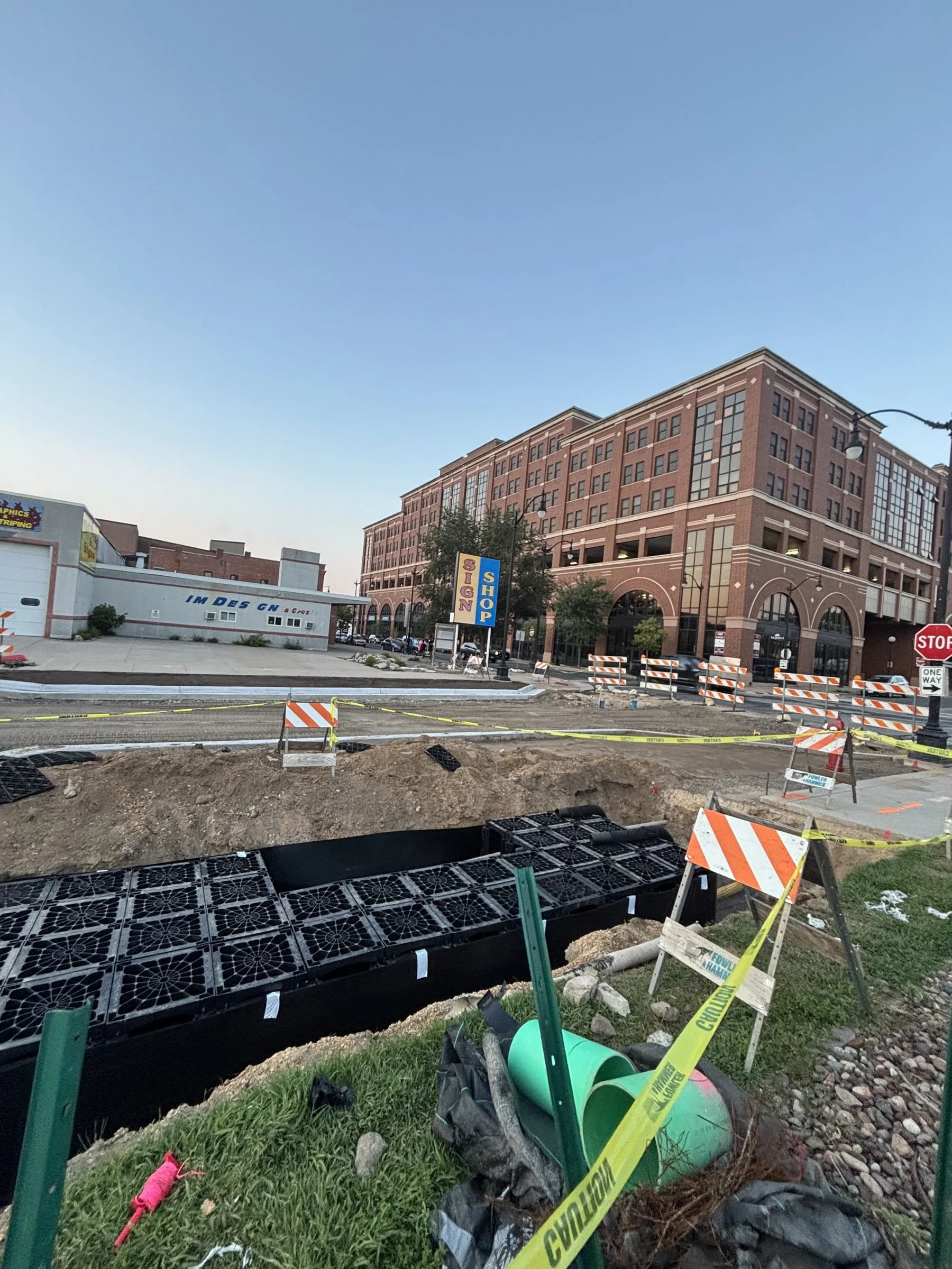 Stormwater detention chamber install beside commercial building