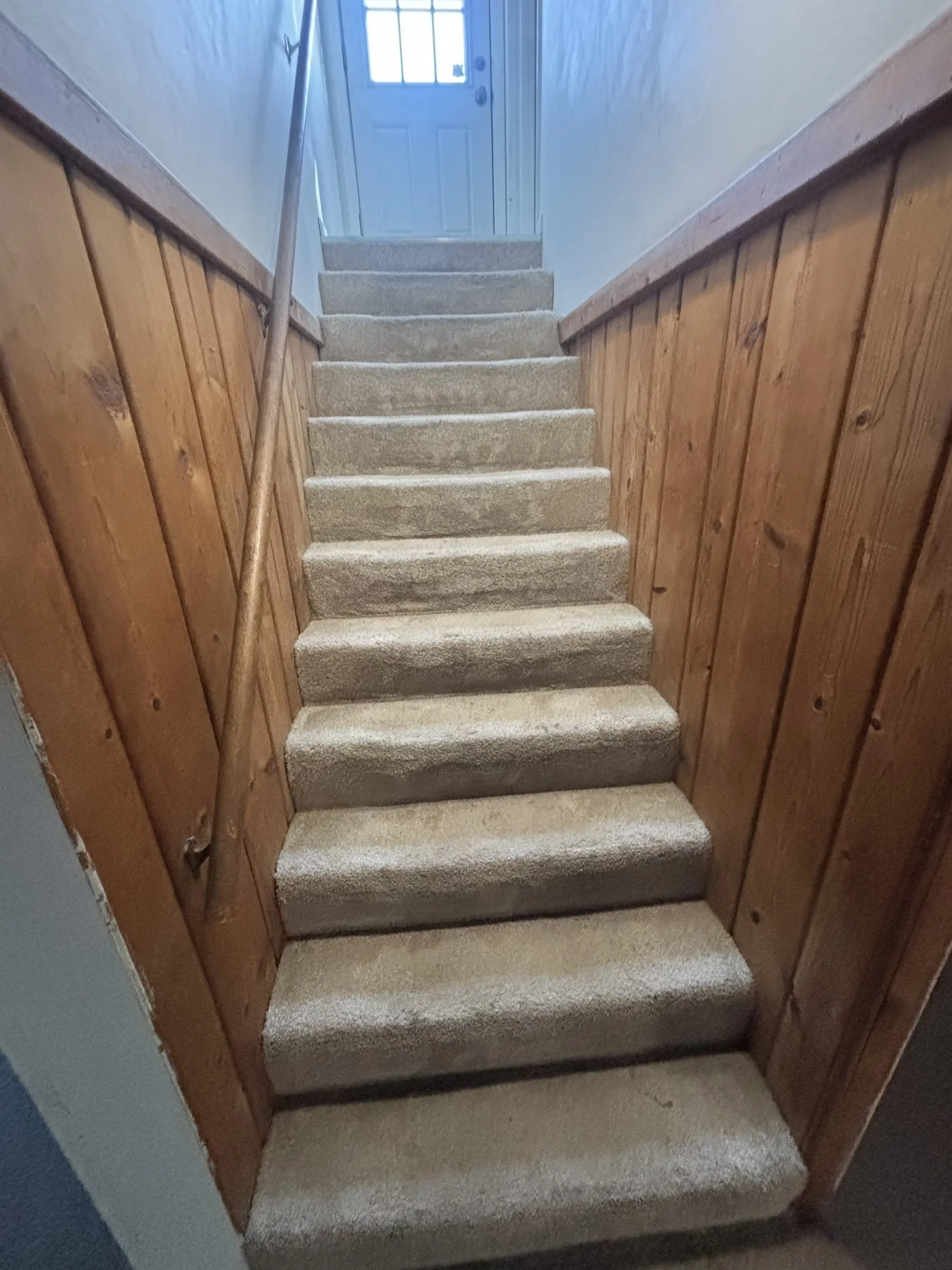 LVP stair treads and landing in apartment stairwell
