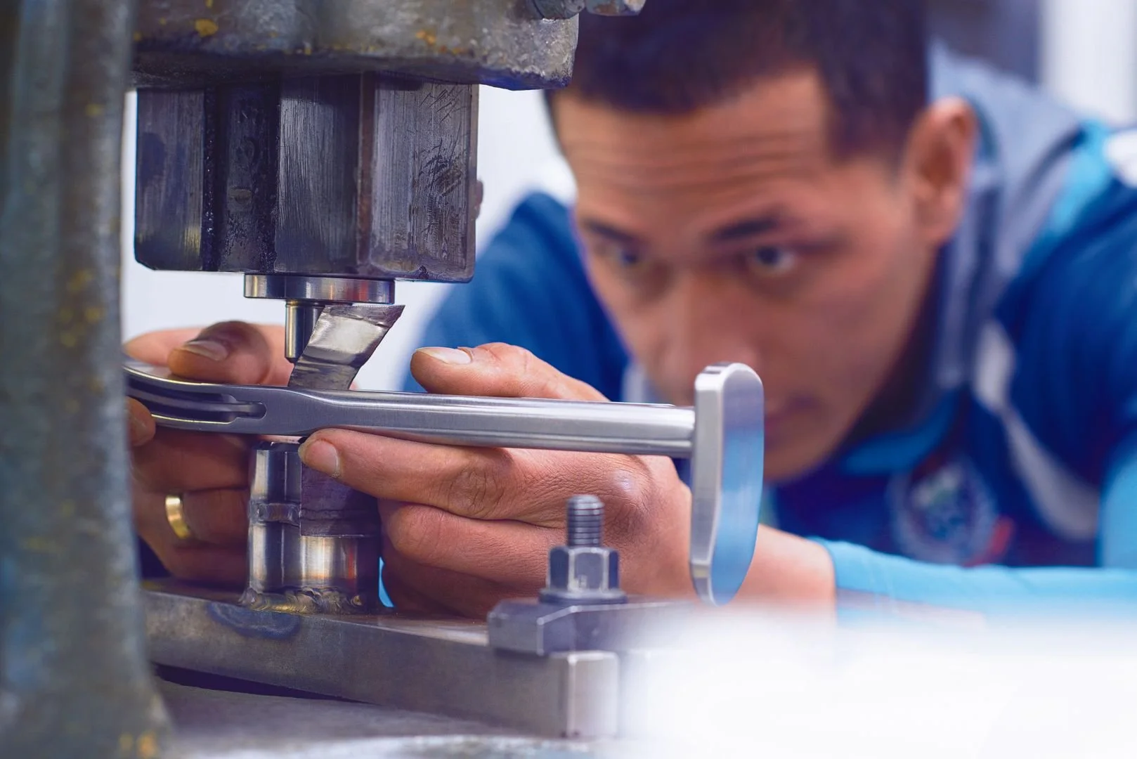 Man using industrial machinery in a workshop