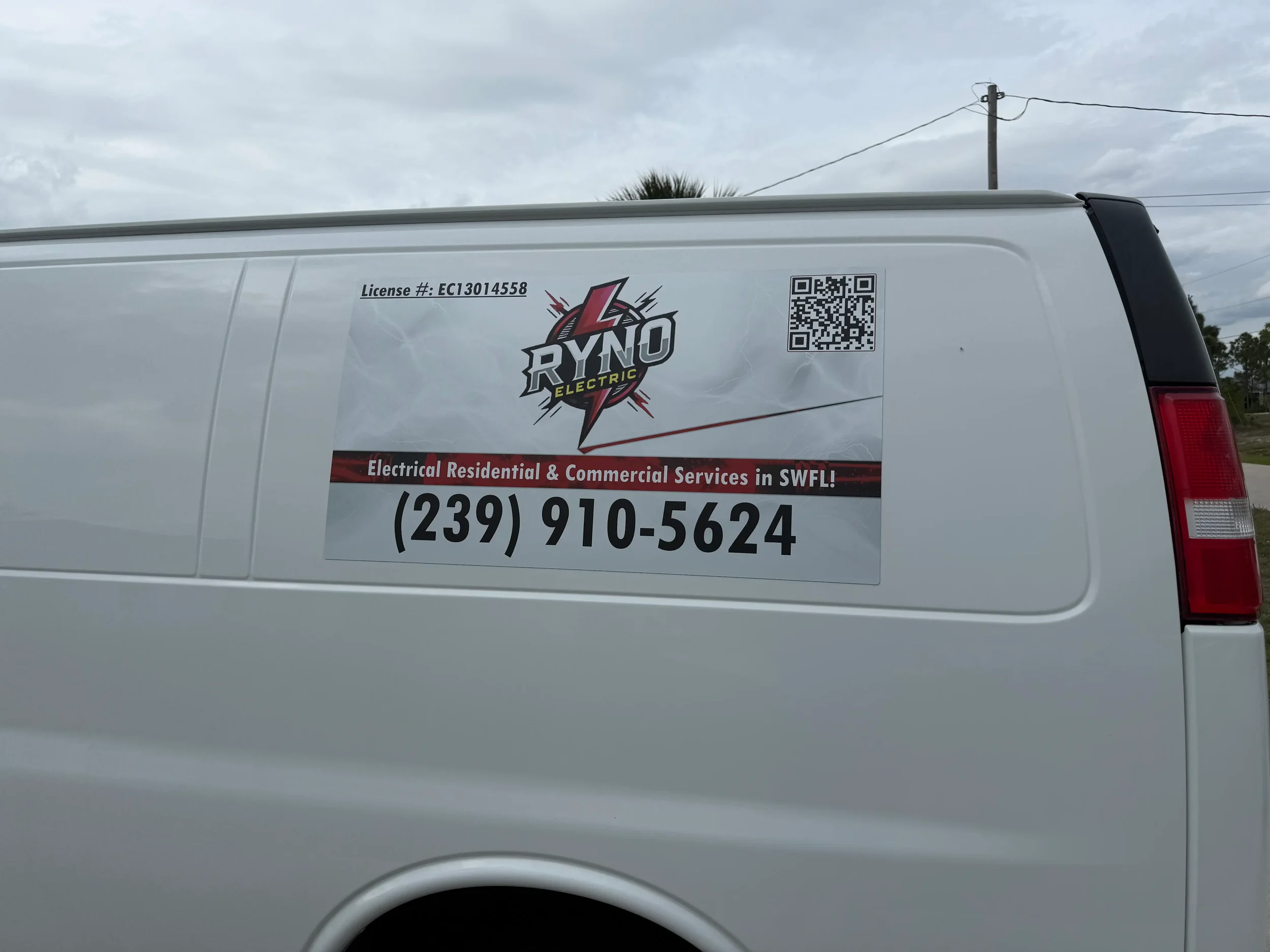 Professional electrician service van featuring clear Ryno Electric branding, license information, QR code, and contact phone number for residential and commercial electrical services in Southwest Florida. This image showcases trusted local electricia