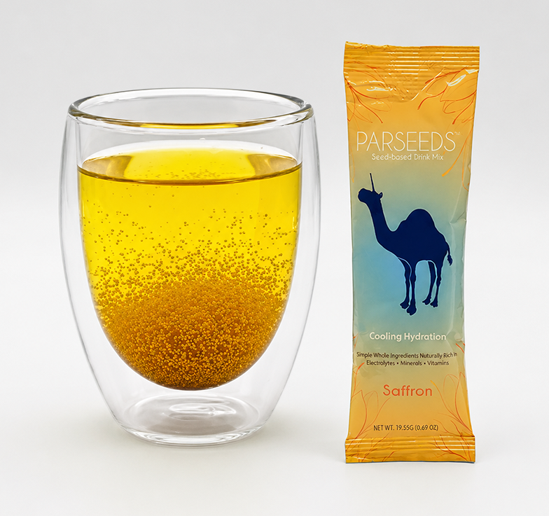 Glass of PARSEEDS khakshir and saffron drink beside stick pack