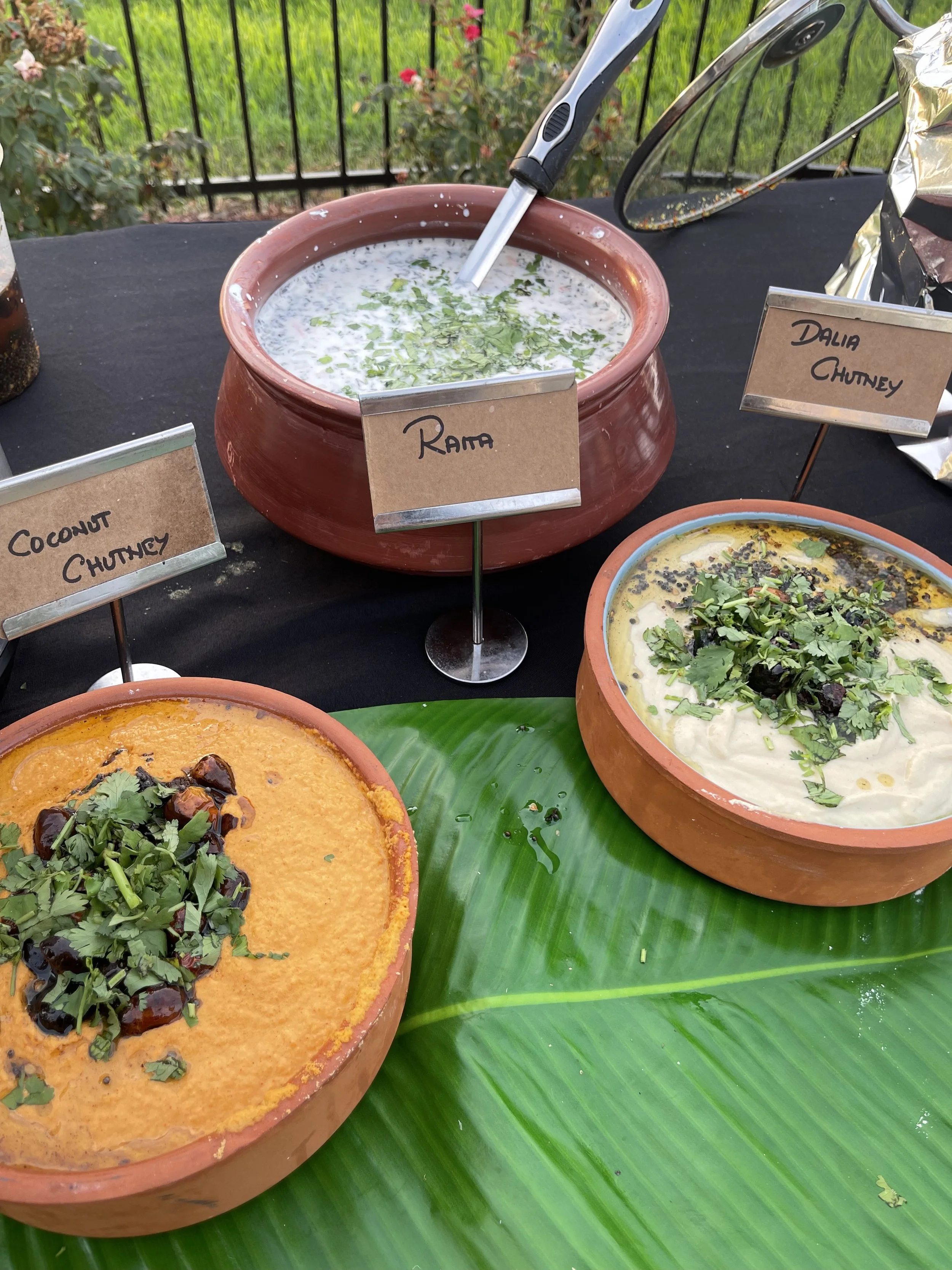 Coconut chutney, dhalia chutney, and raita station