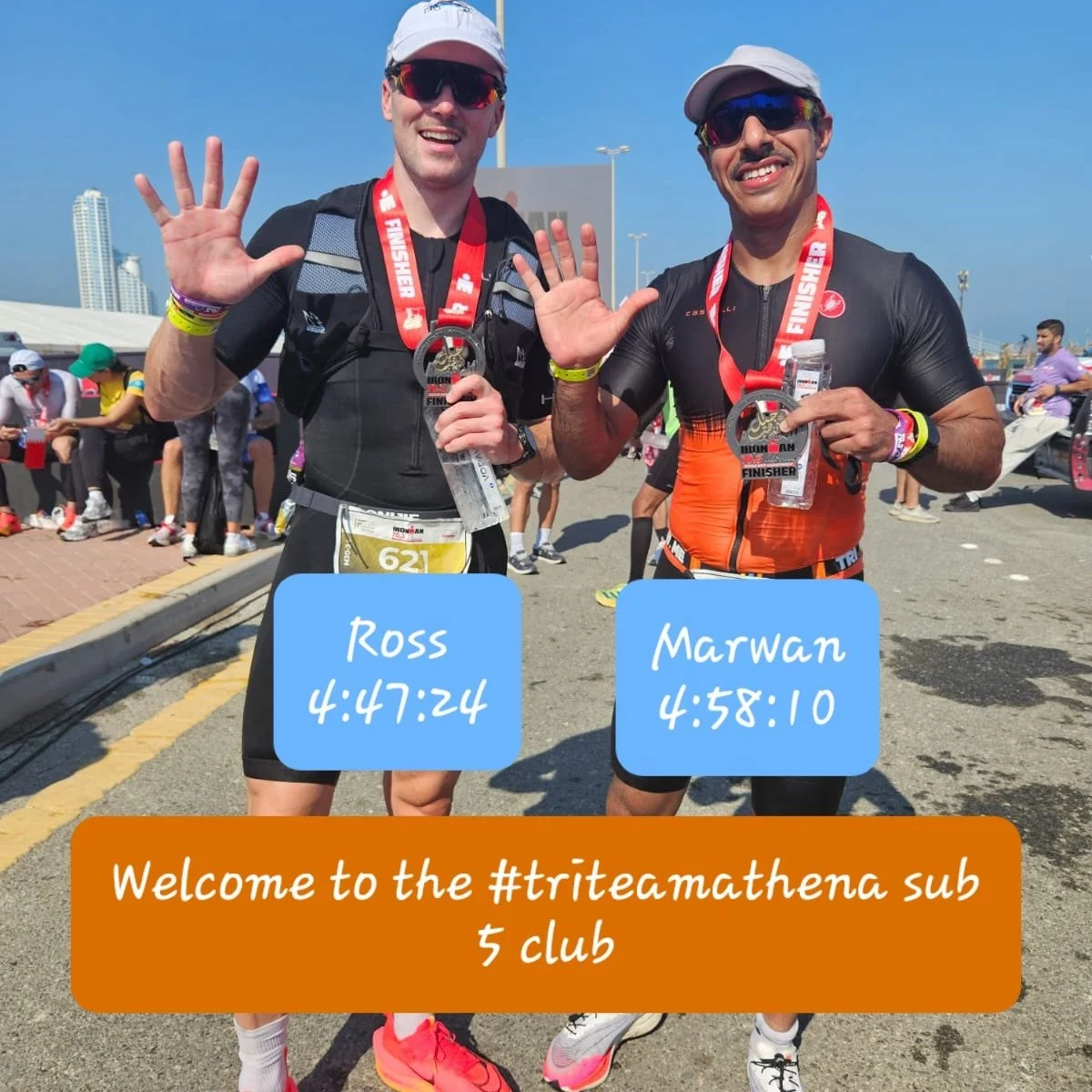 Two male marathon runners standing outdoors at race finish line, smiling and holding medals. The runner on the left is named Ross with a time of 4:47:24, and the runner on the right is named Marwan with a time of 4:58:10. Both are wearing athletic gear and sunglasses. A sign in the background indicates a cityscape, and a banner in the foreground says, "Welcome to the #tritcmathena sub 5 club."