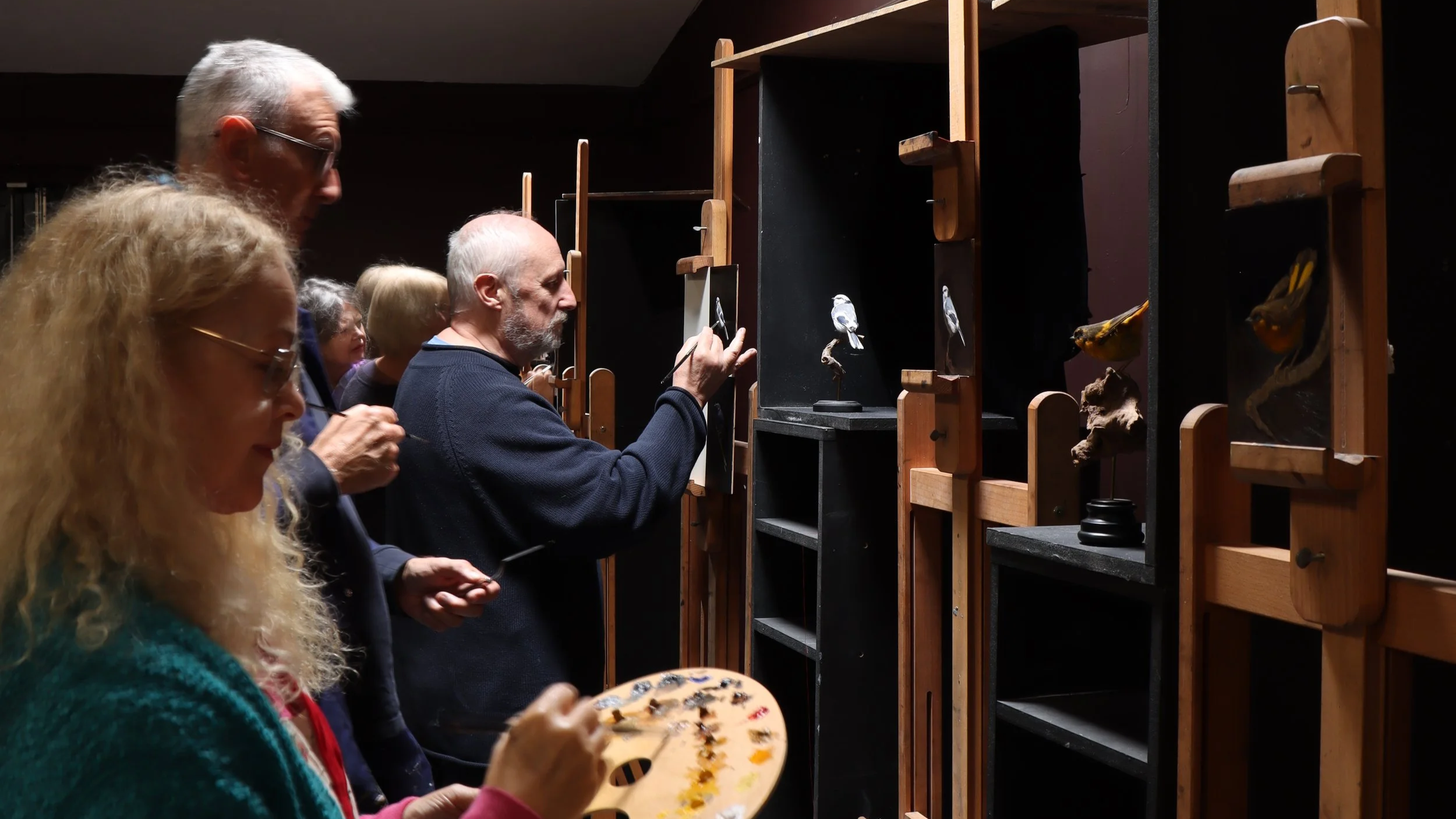 A group of students working on their paintings during the 'Bird Painting in Oils' class at the Atelier.