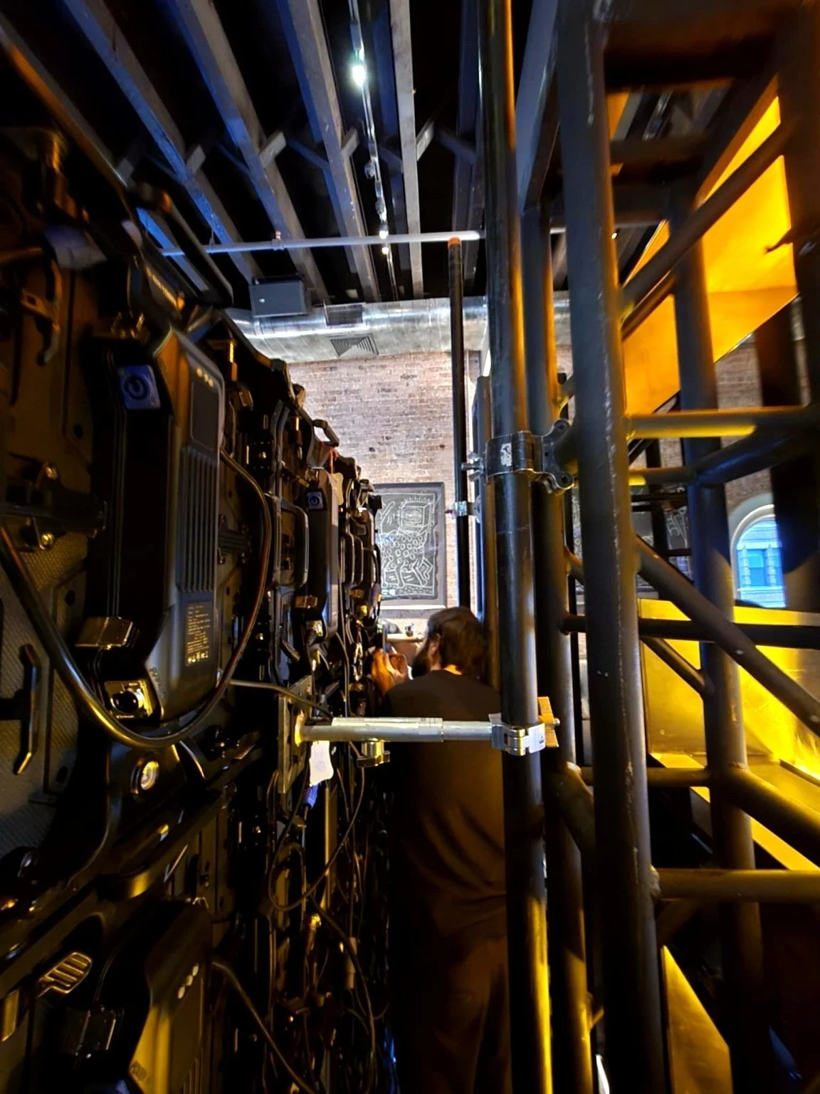 Geometric drawing of an outline square with sections divided by vertical, horizontal, and diagonal lines.