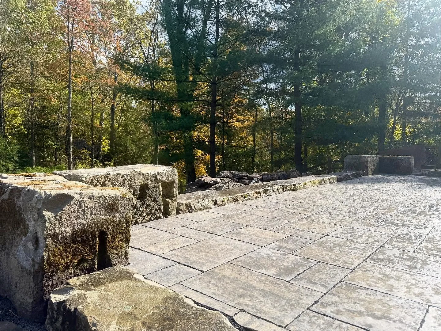 Love how this project turned out! The natural barn stones pair beautifully with these stunning pavers from @unilock, selected to complement the existing stone on the house. The bubbling rock creates a great focal point, bringing everything together w