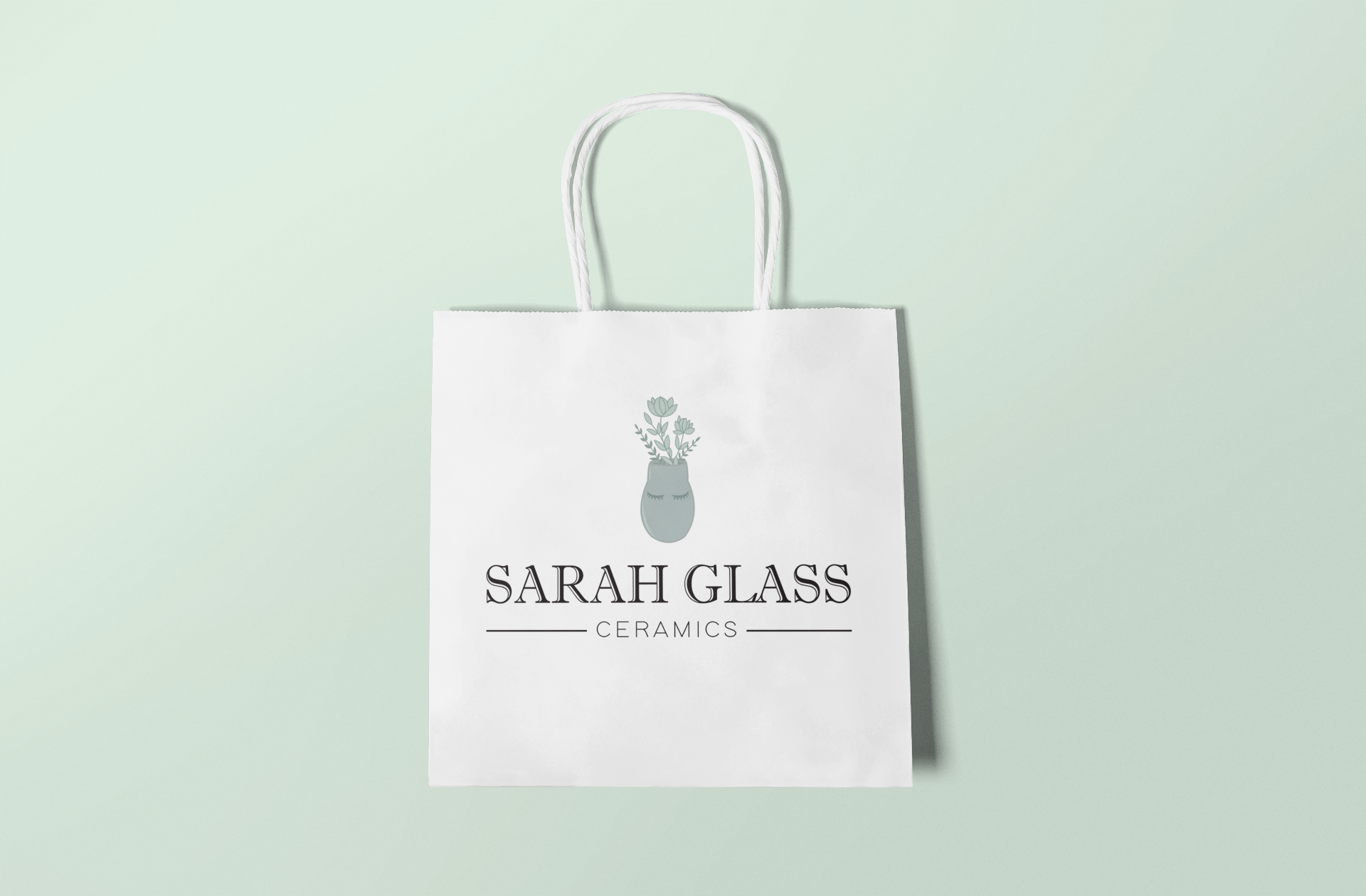 mockup-of-a-squared-gift-bag-lying-flat-on-a-colored-background-650-el (1).png