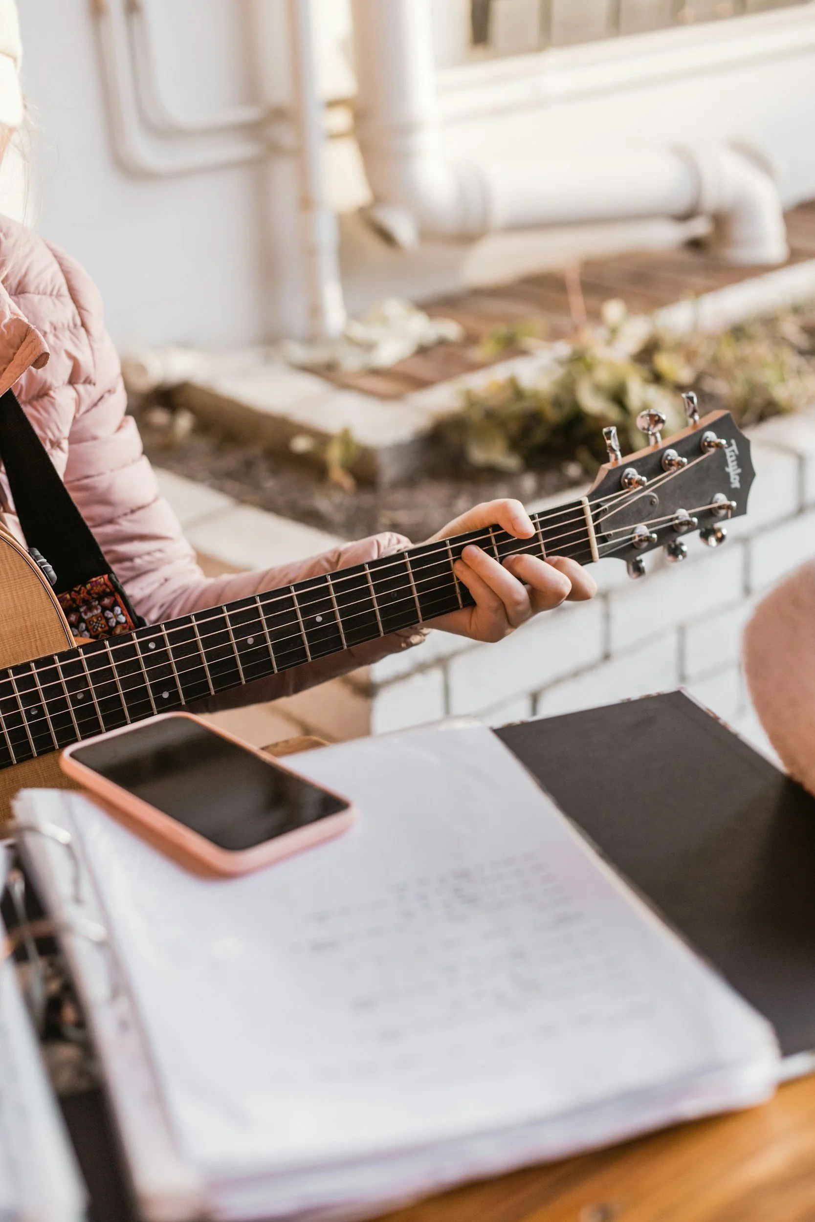Singer-songwriter refining song ideas and selecting material for recording and artist development.