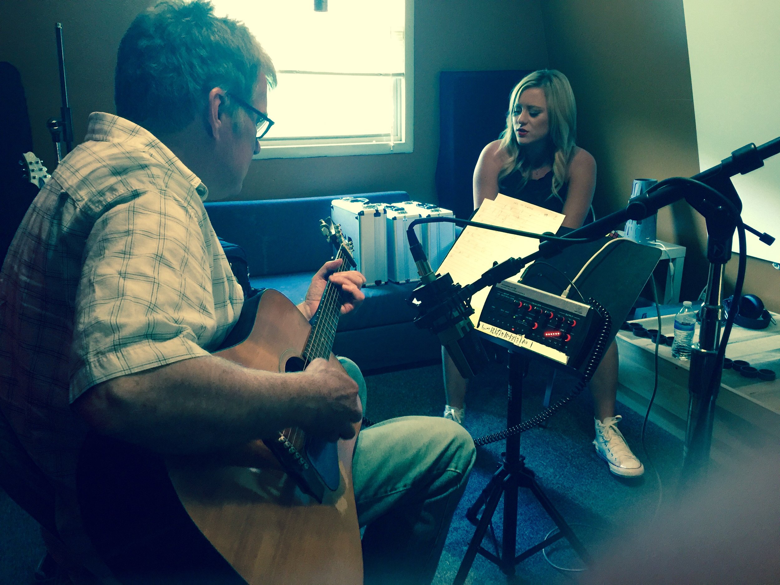 Singer-songwriter developing a song in a Nashville recording session