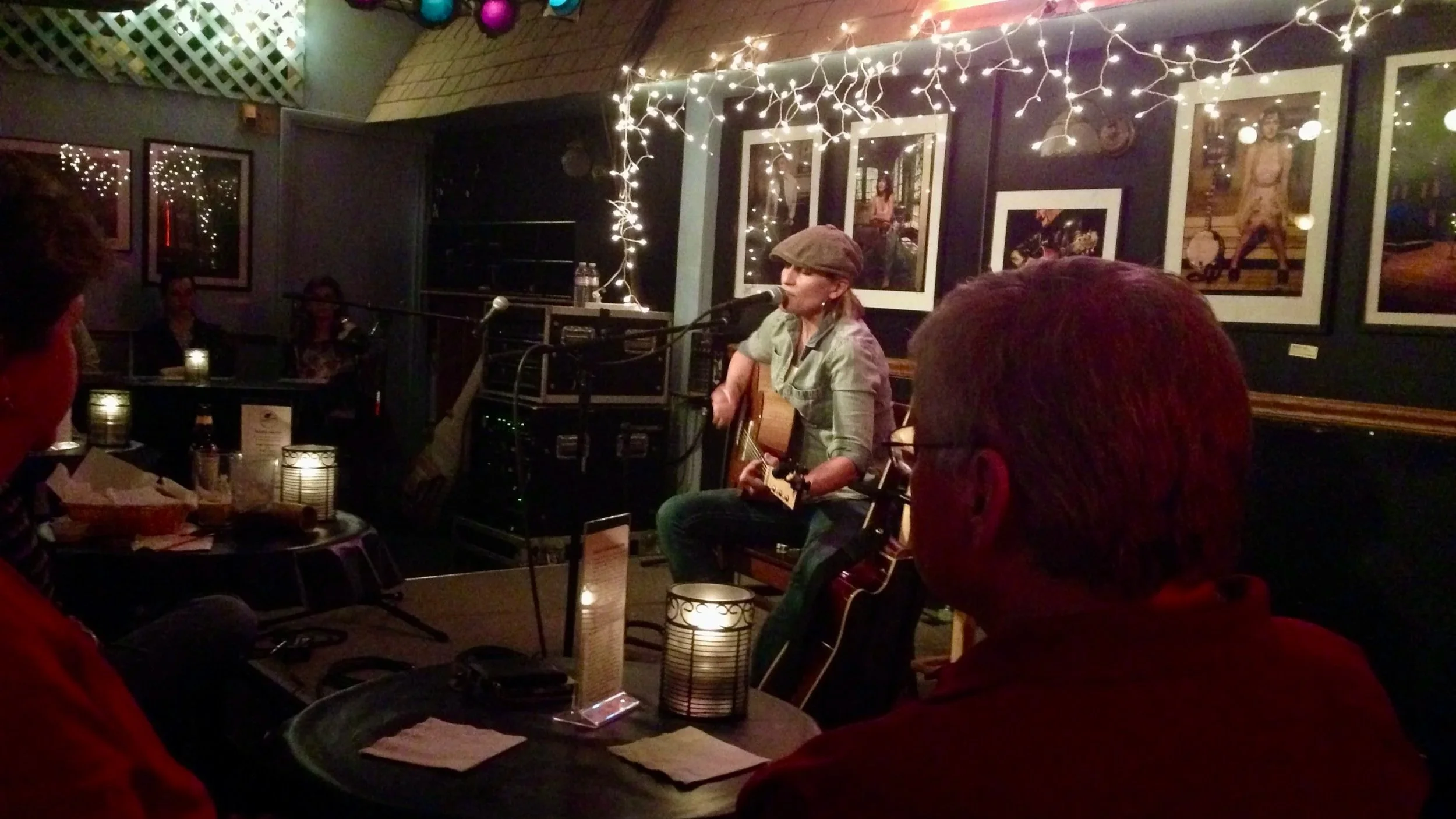Singer-songwriter performing live for an audience at The Bluebird Cafe in Nashville, Tennessee