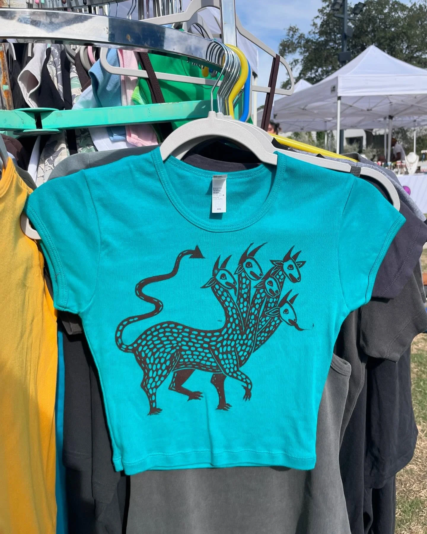 All set up at @thefront.market today from 11-5 at moody amphitheater/waterloo greenway! Come snag a little creature shirt 🥹